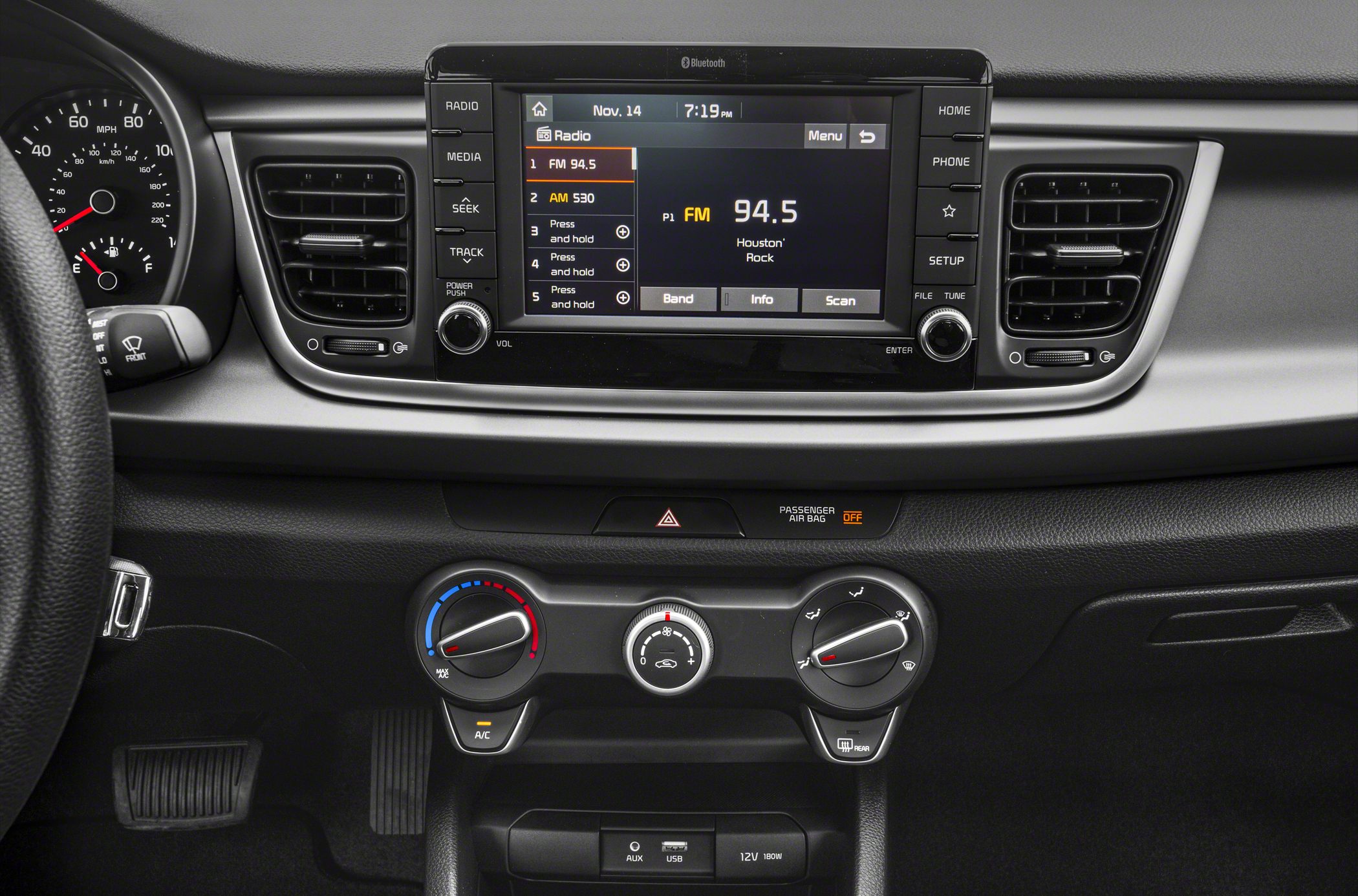 Infotainment screen with radio and manual climate control panel