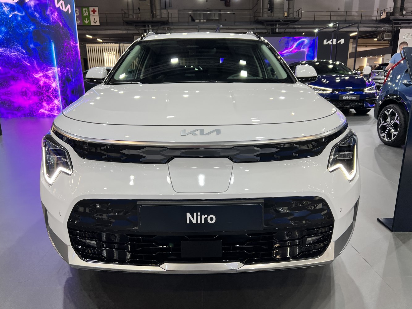 Front view with distinctive LED headlights and hexagonal grille