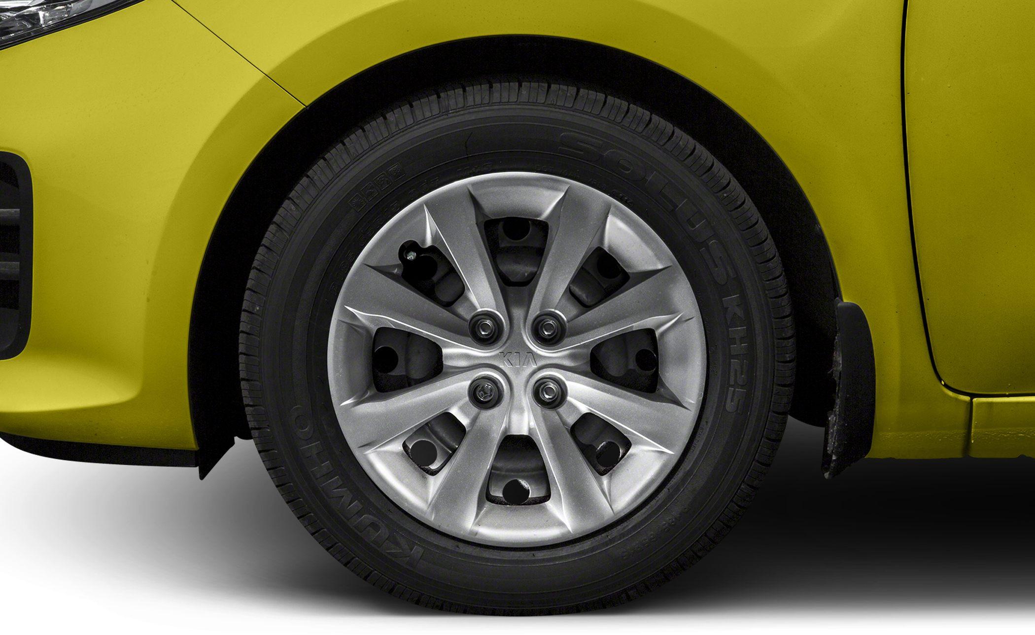 Close-up of alloy wheel and tire on hatchback vehicle