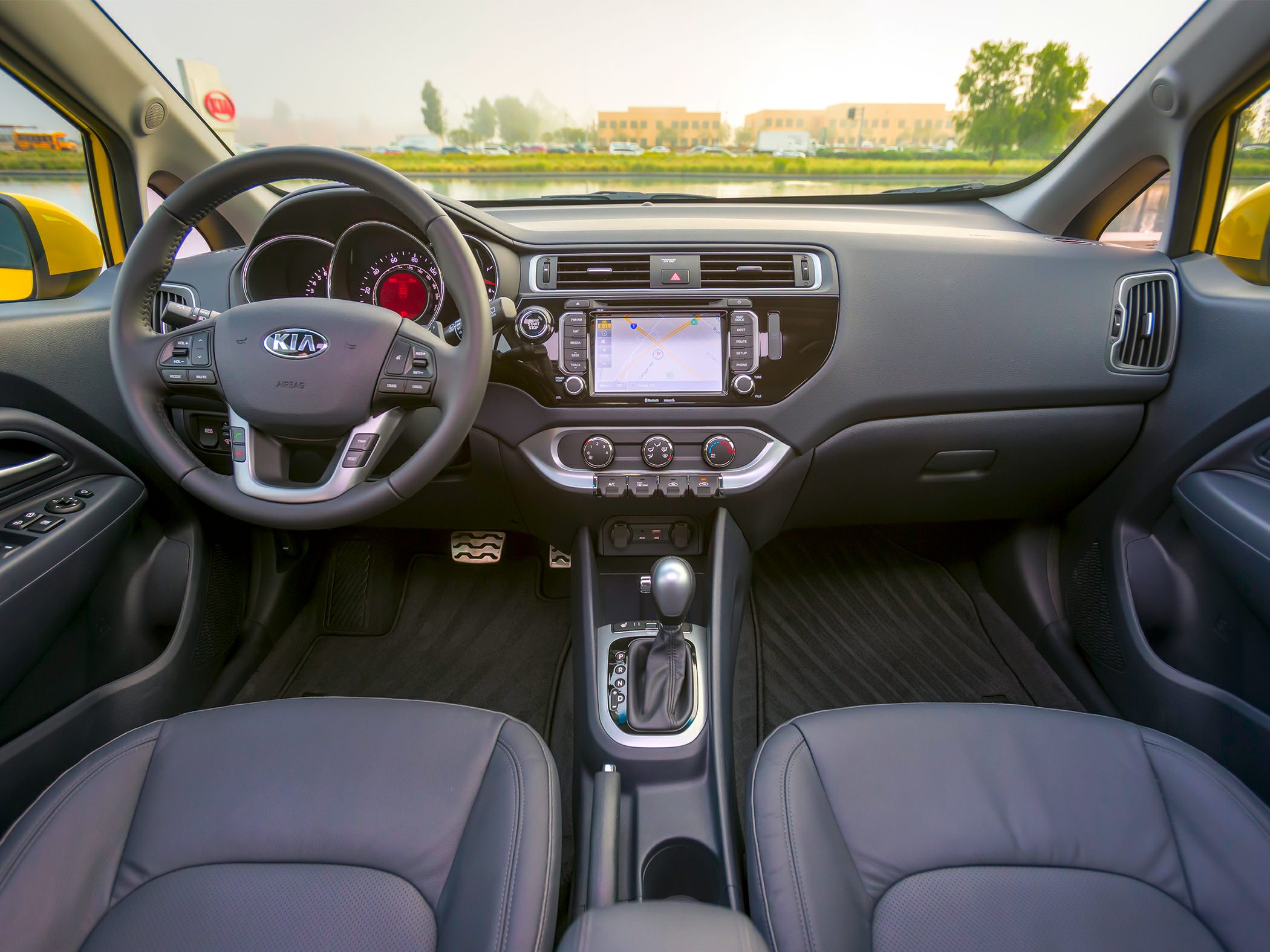 Dashboard, steering wheel, infotainment system, and gear shift layout