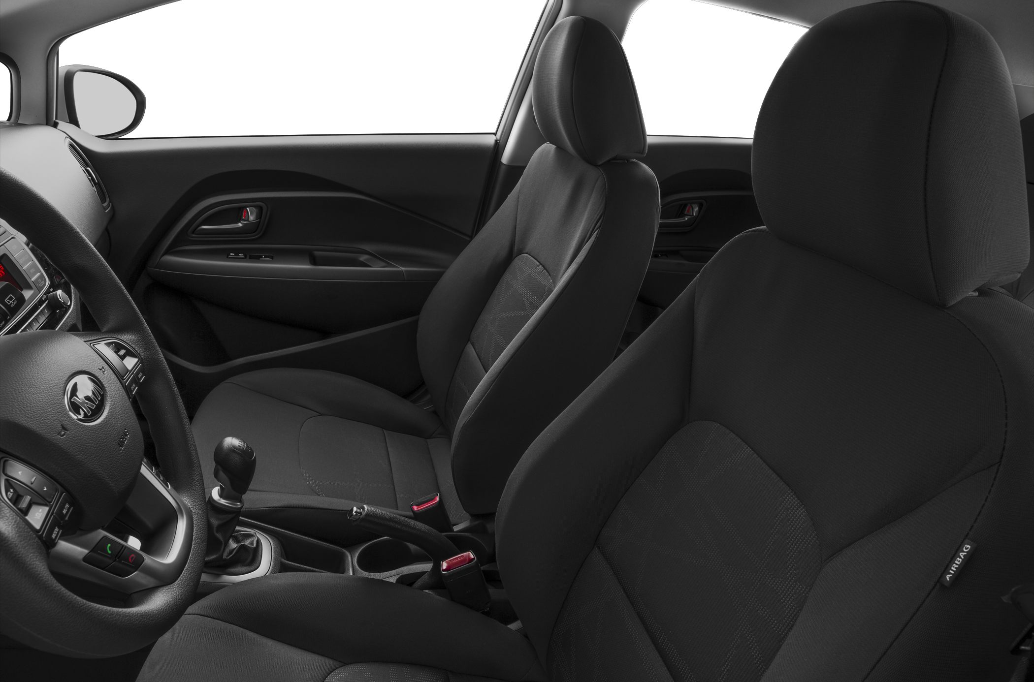 Fabric front seats and dashboard with manual gear shift.