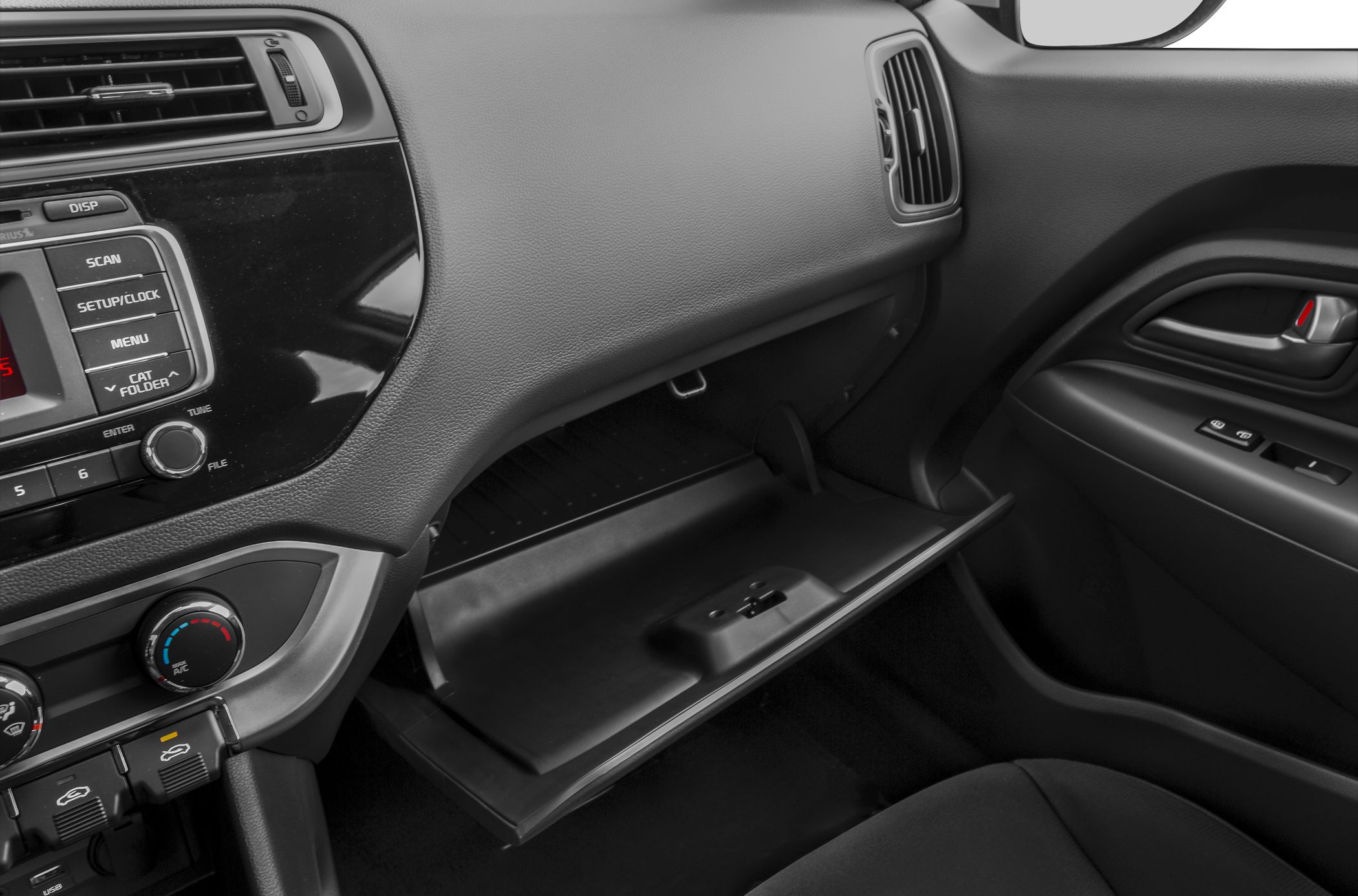 Interior showing open glove box and dashboard controls