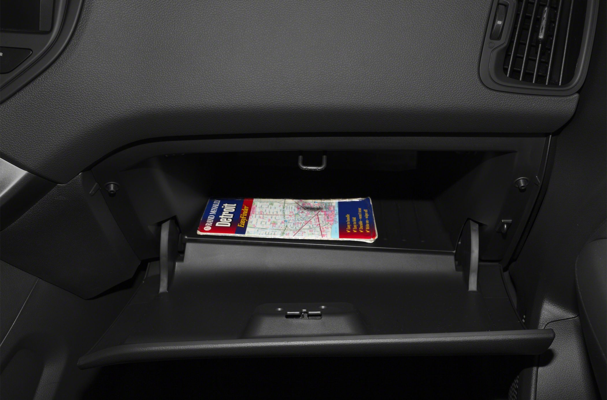 Open glove compartment with a road map inside
