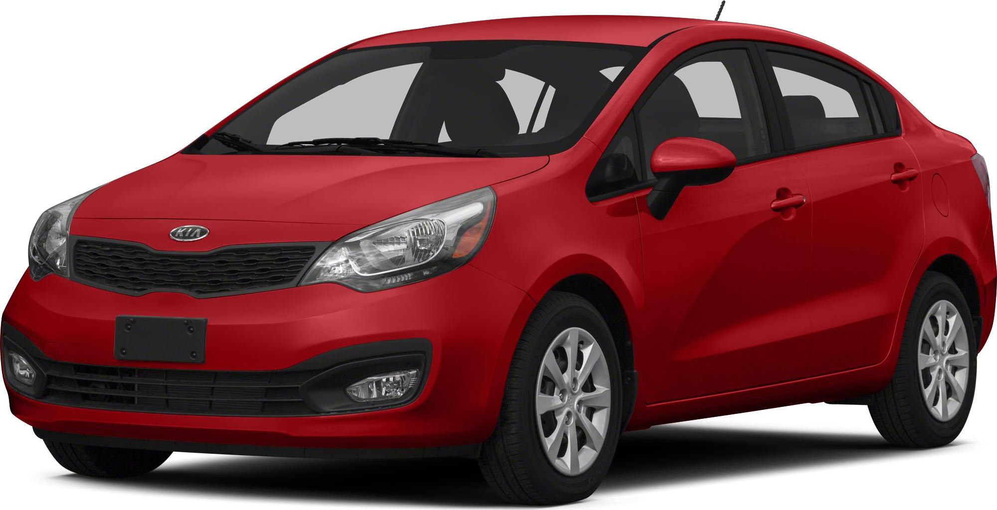 Red compact sedan with prominent grille and aerodynamic headlights