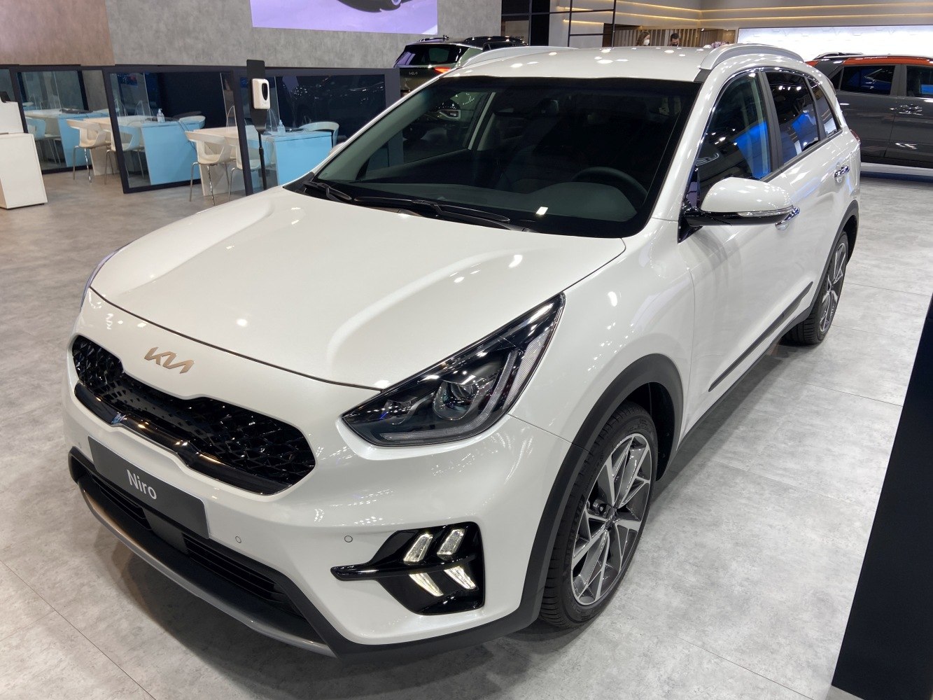 Front angled view with LED headlights and alloy wheels