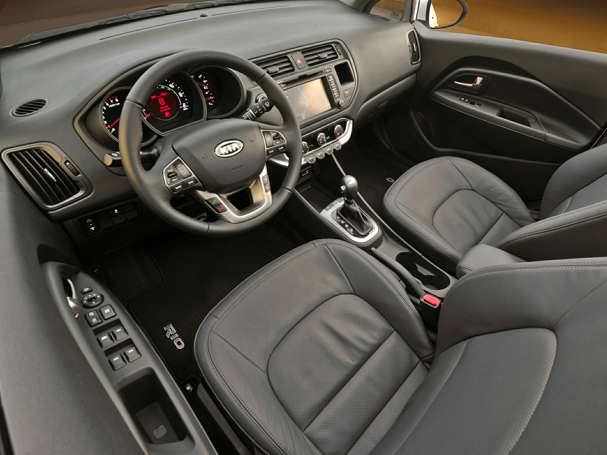 Black interior with leather seats, multi-function steering wheel, touchscreen, automatic gear shifter