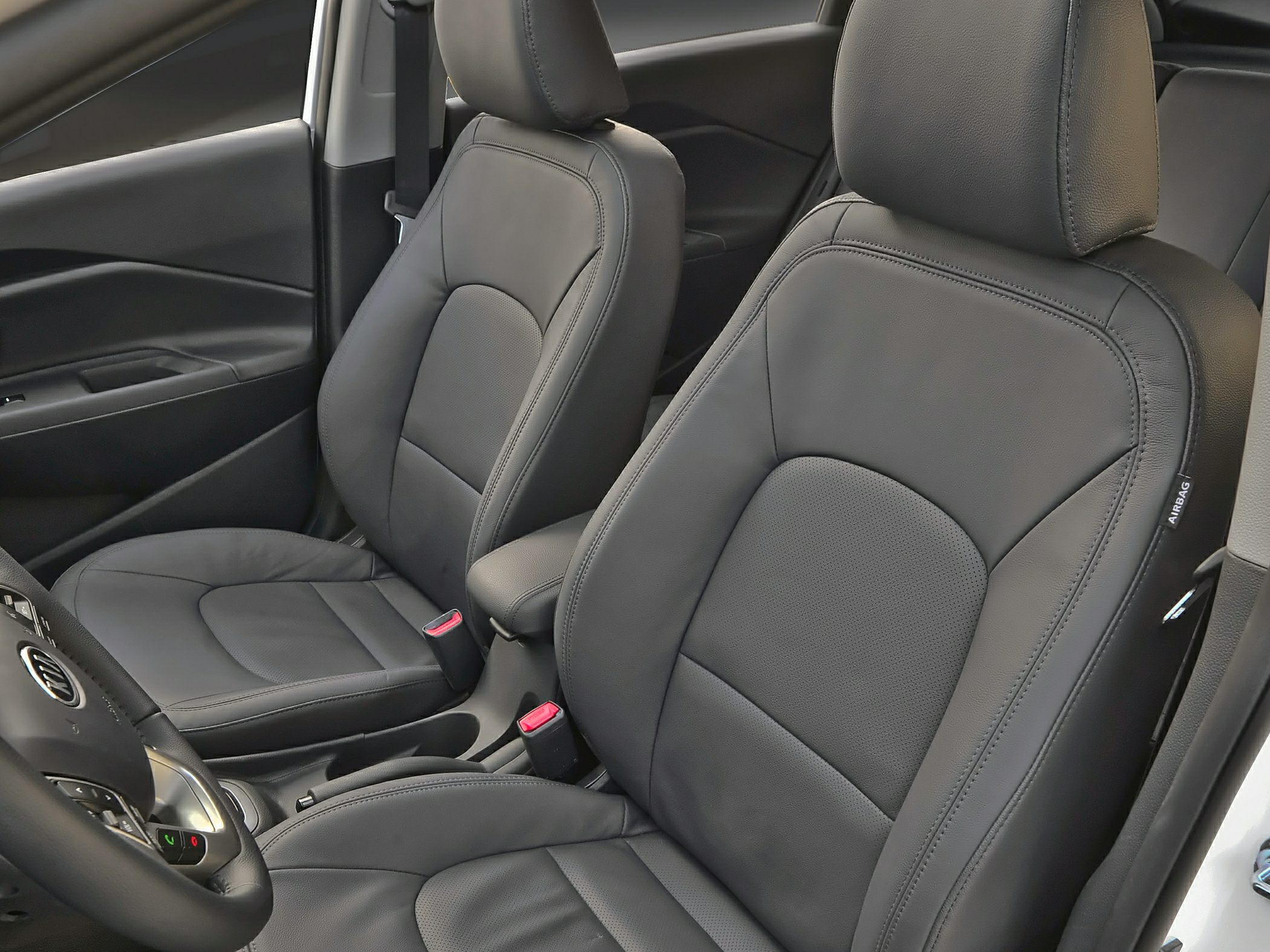 Black leather front seats with detailed stitching and headrests