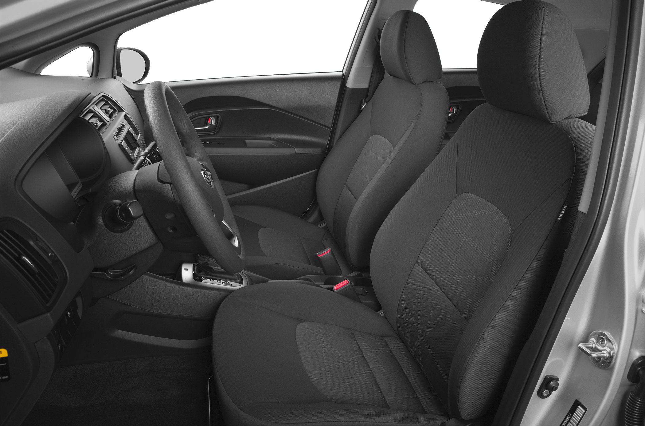 Front seats and dashboard interior view with steering wheel and upholstery