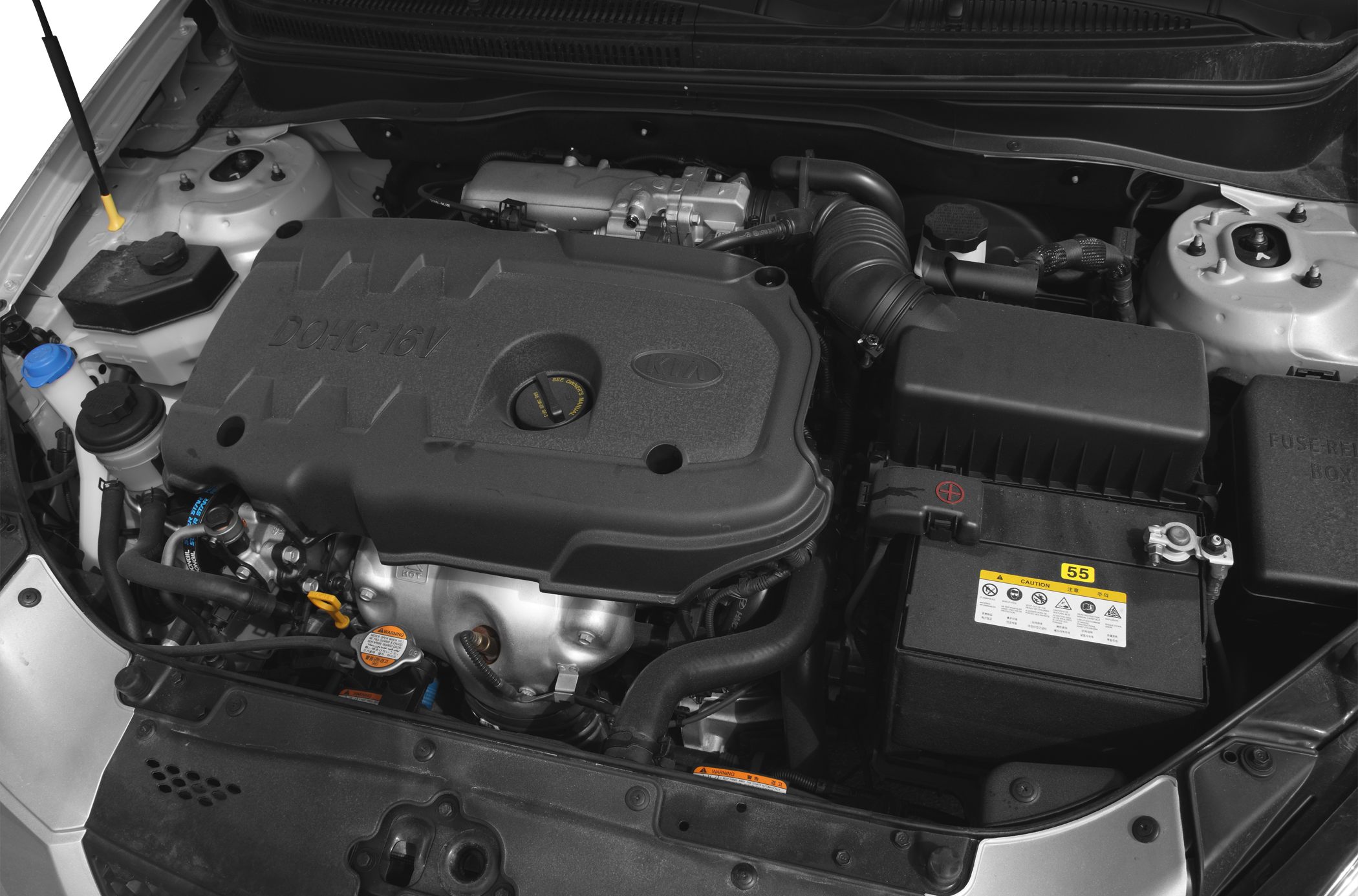 Engine compartment with DOHC 16V cover and car battery