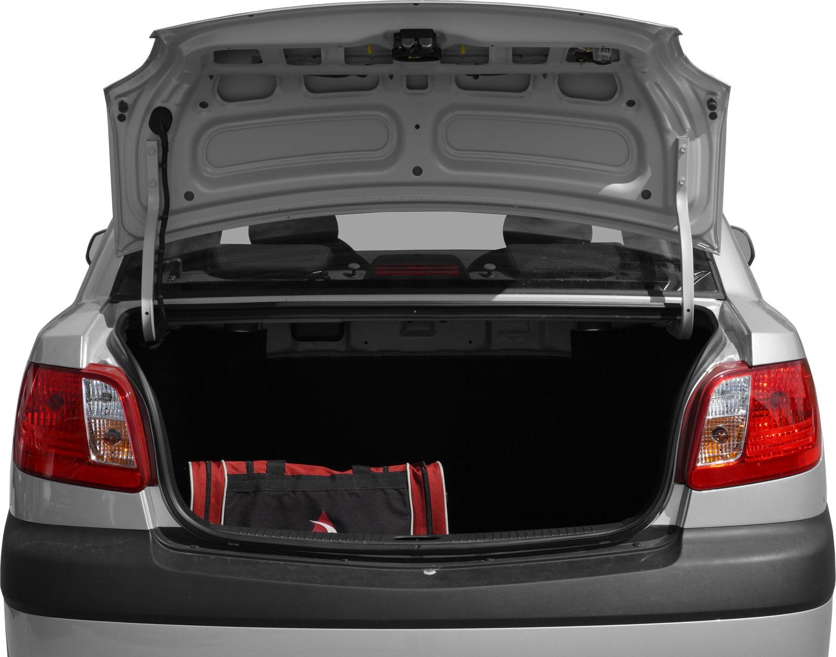 Open sedan trunk with spacious cargo area and dual rear tail lights