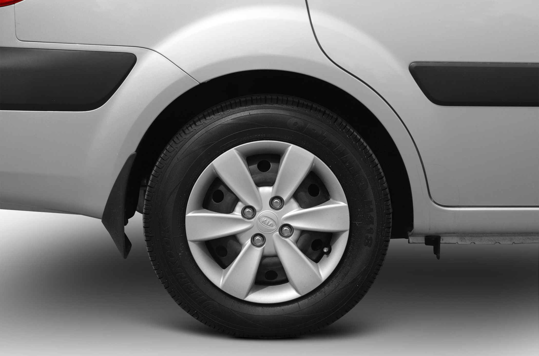 Rear alloy wheel and fender of compact sedan