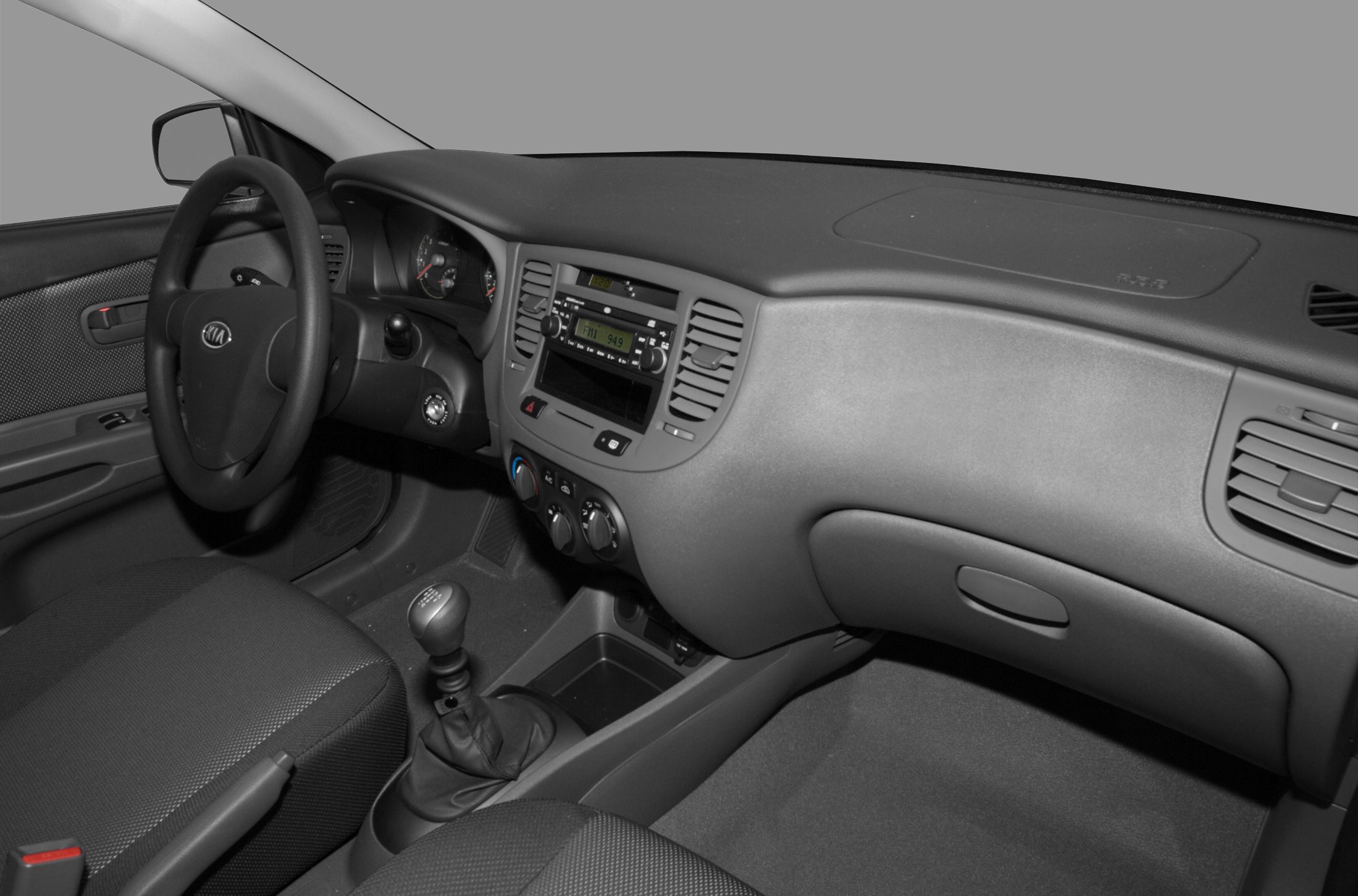 Compact sedan dashboard and manual gear shift close-up