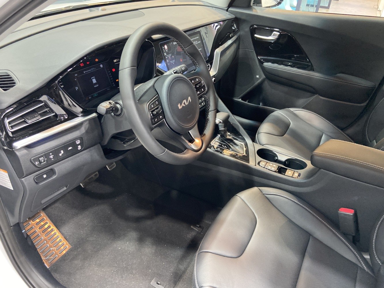 Modern steering wheel, digital dashboard, premium seats interior