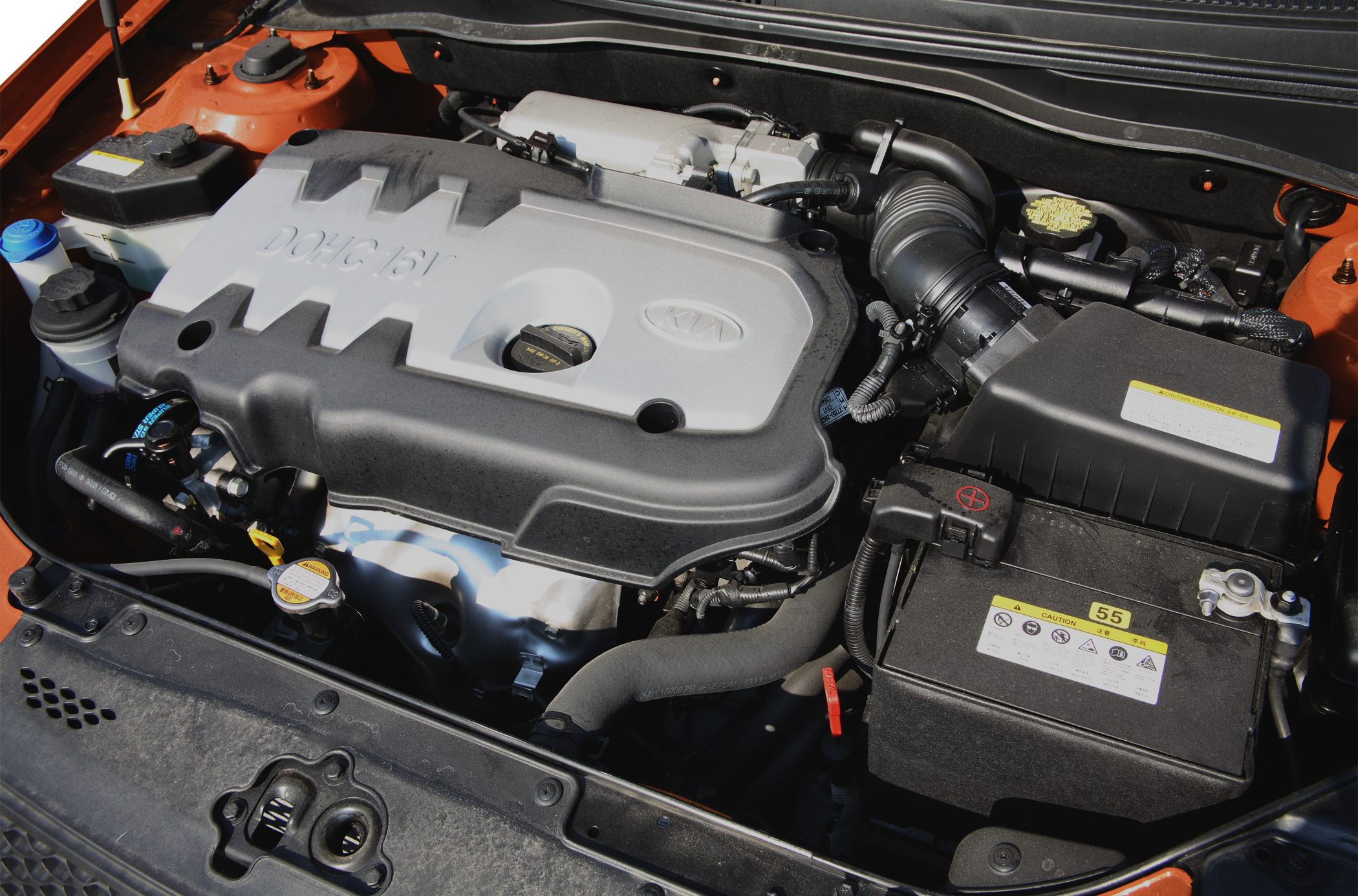 DOHC 16V engine with components in a hatchback engine bay.