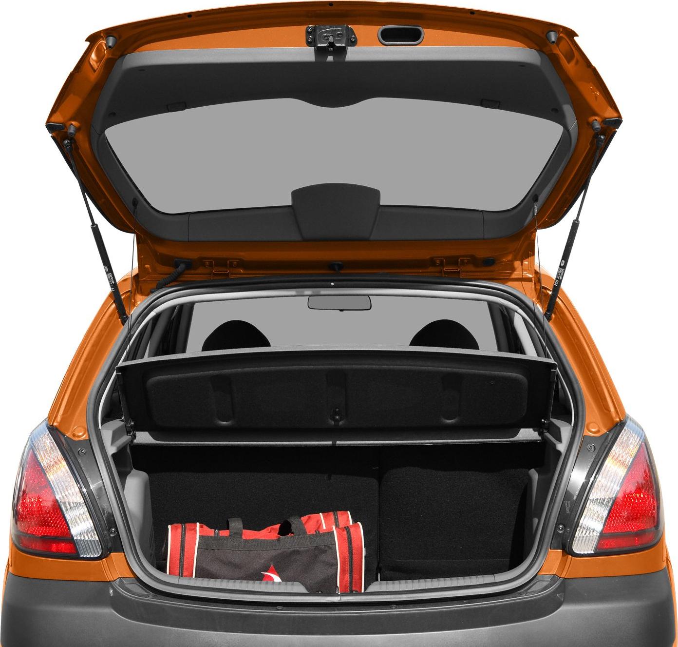 Open trunk with parcel shelf and red bag inside