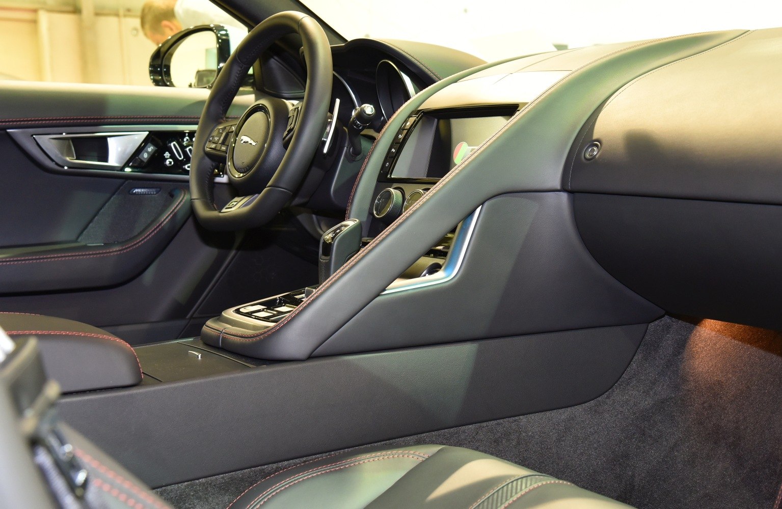 Luxury car interior with leather upholstery and detailed stitching
