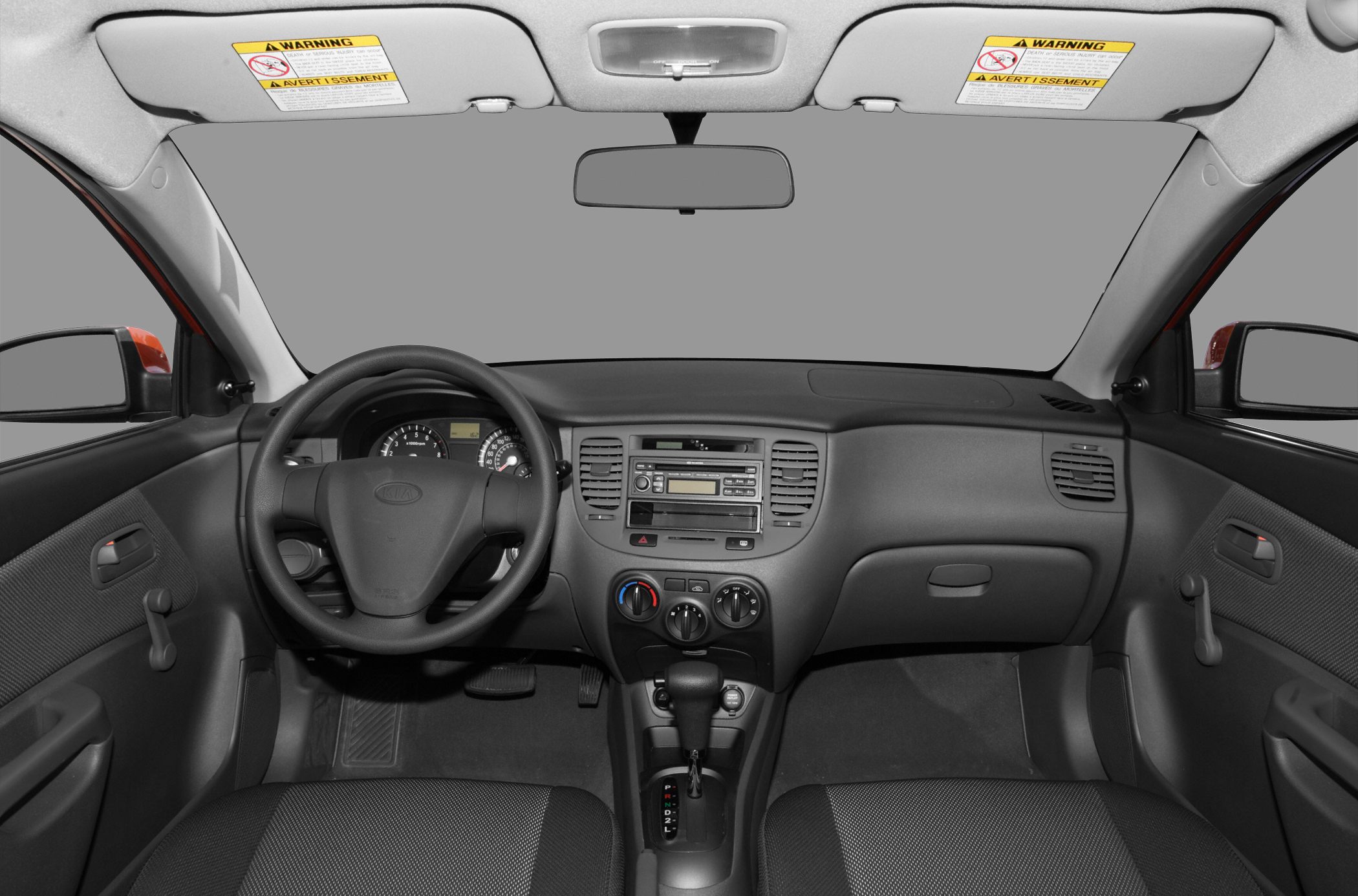 Dashboard layout with steering wheel, central controls, and automatic gear shifter