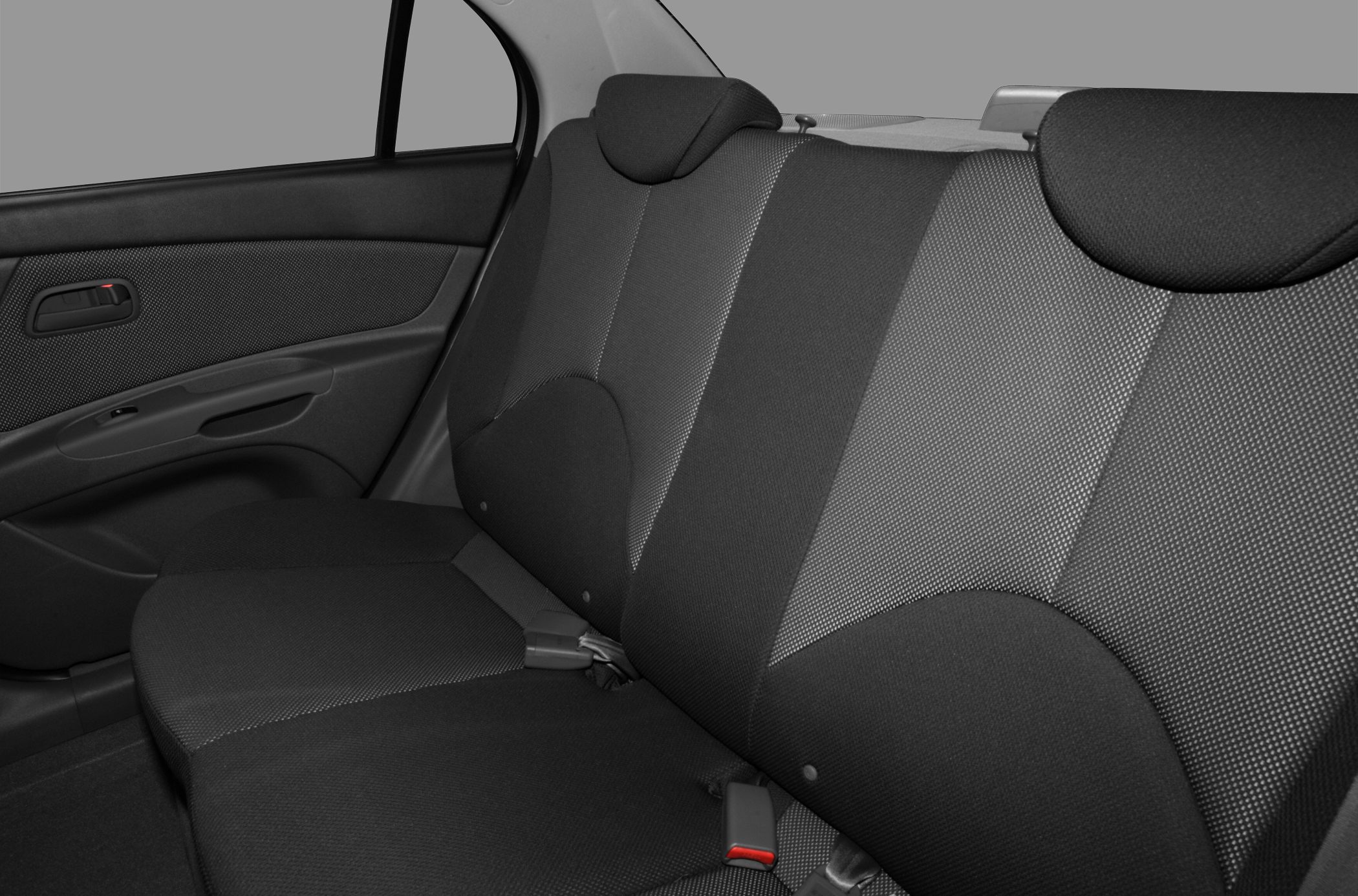 Fabric upholstered rear seat with headrests and door panel.