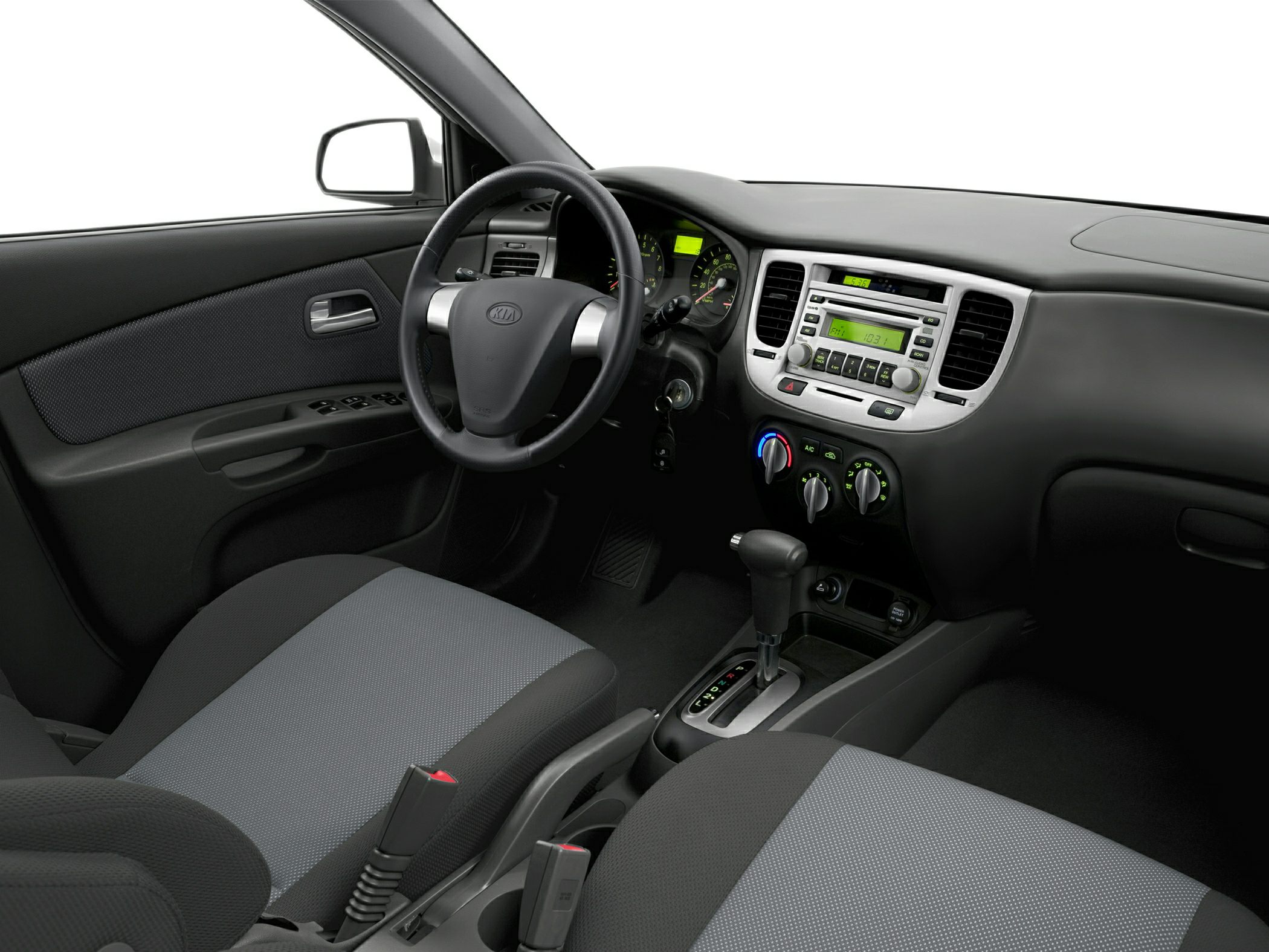 Dashboard, steering wheel, and center console with climate and audio controls