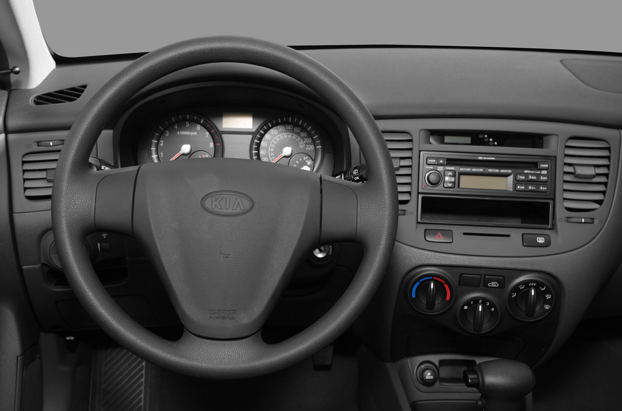 Steering wheel, instrument cluster, and dashboard with controls