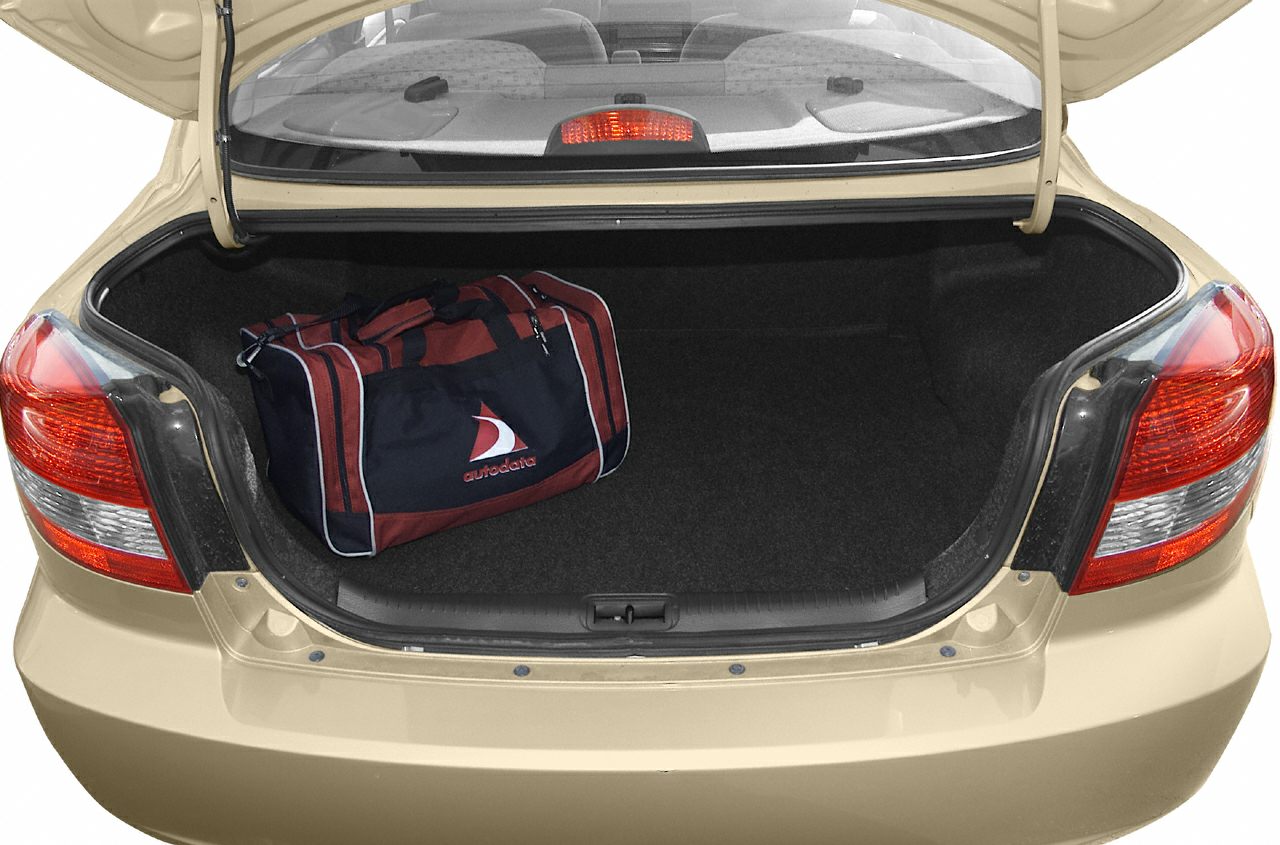 Open sedan trunk with spacious cargo area and sports bag inside