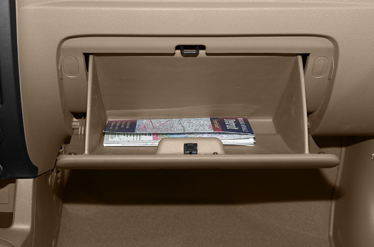 Open glove box with documents inside