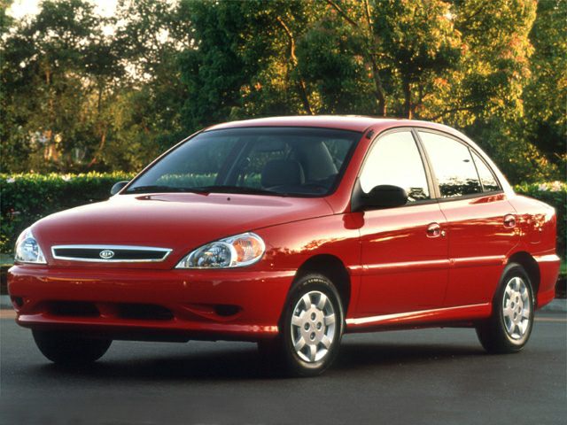 Front side view of a compact four-door sedan with alloy wheels