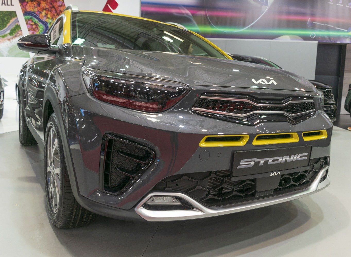 Close-up of car front with LED headlights and distinctive grille