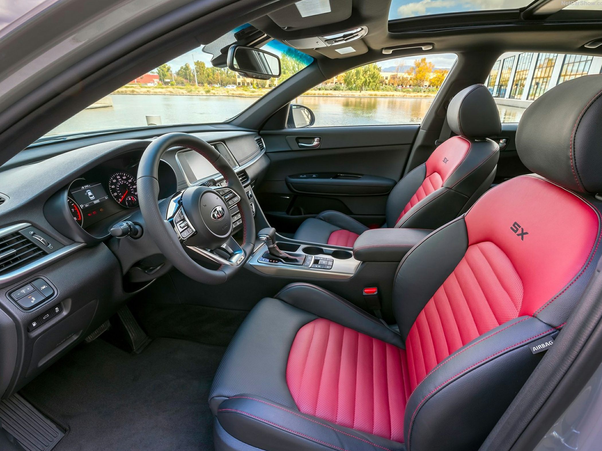 Red SX sport seats, modern dashboard, panoramic sunroof