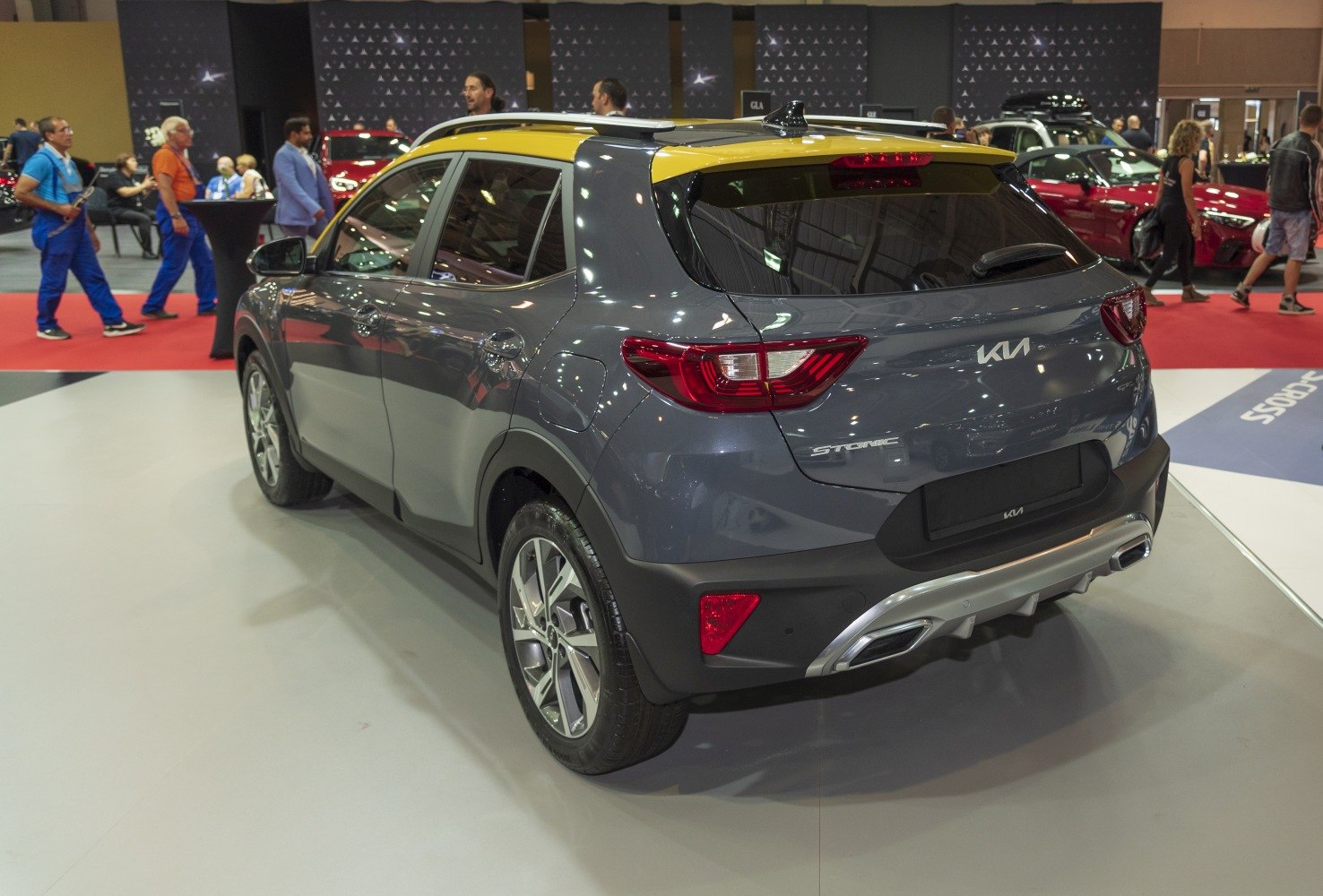 Rear exterior view with distinctive taillights and yellow two-tone roof