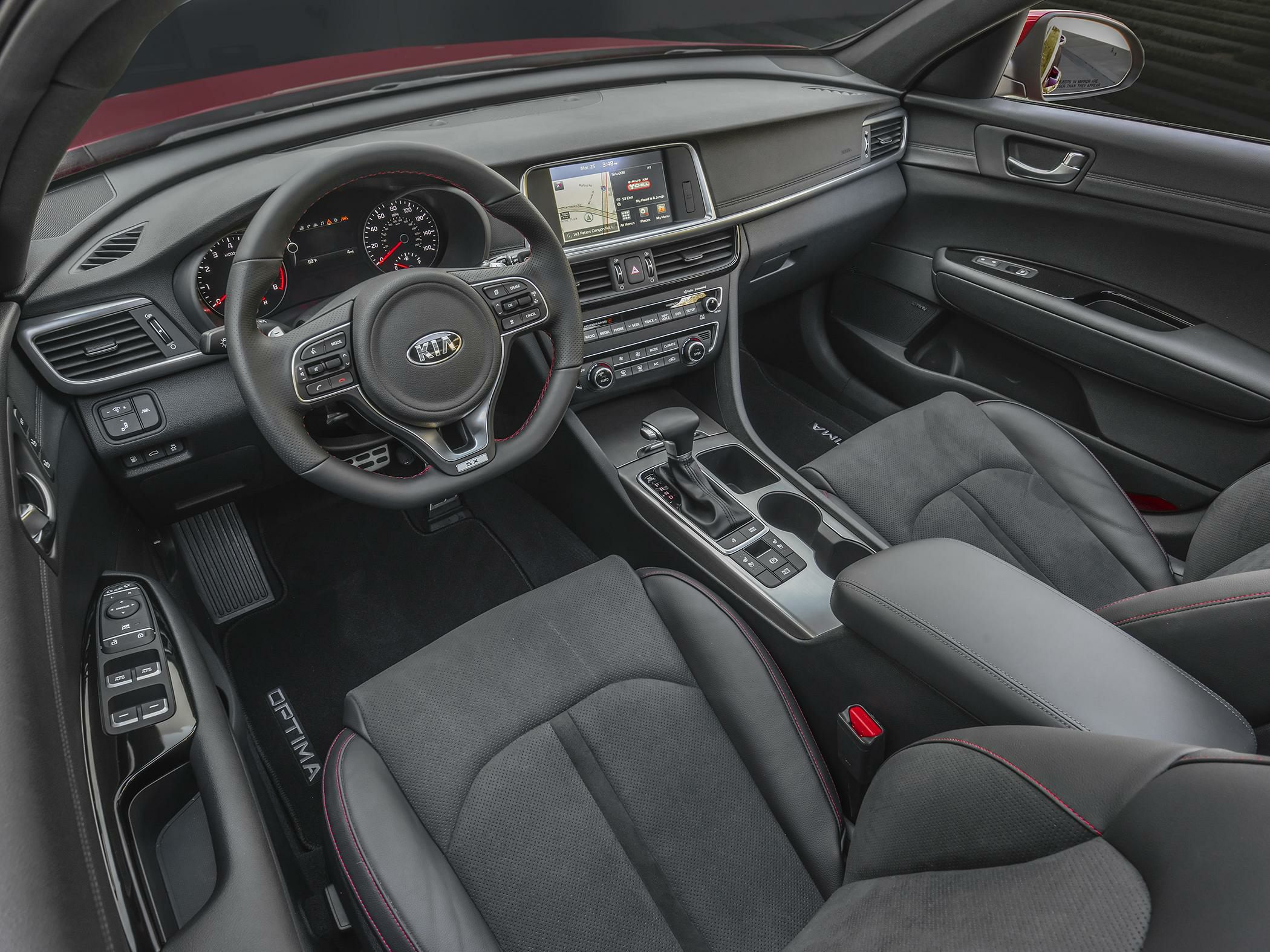 Modern car interior with touchscreen display and multifunction steering wheel