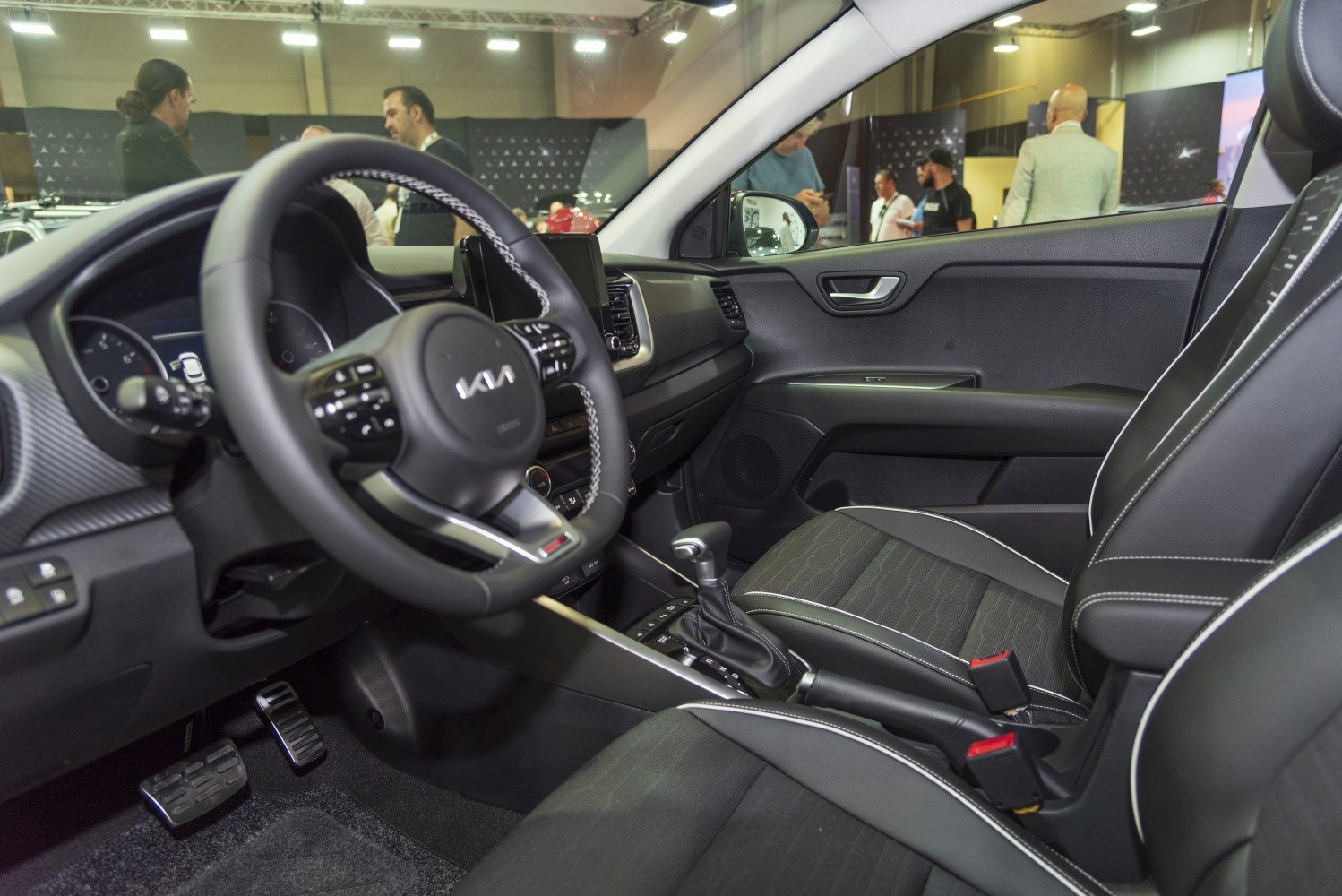 Steering wheel and gear shift lever with ergonomic interior design