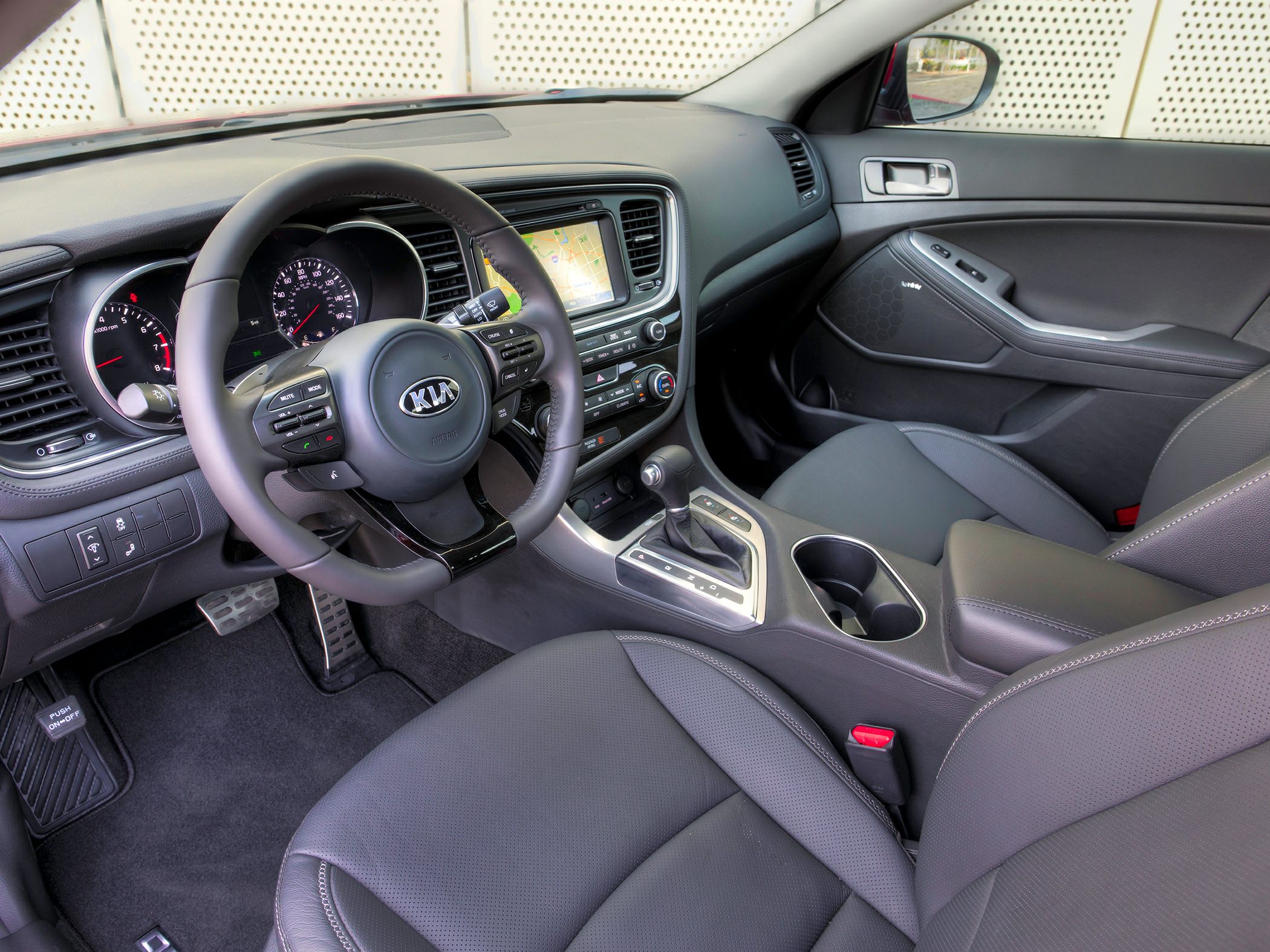 Dashboard, steering wheel with controls, and center console interior