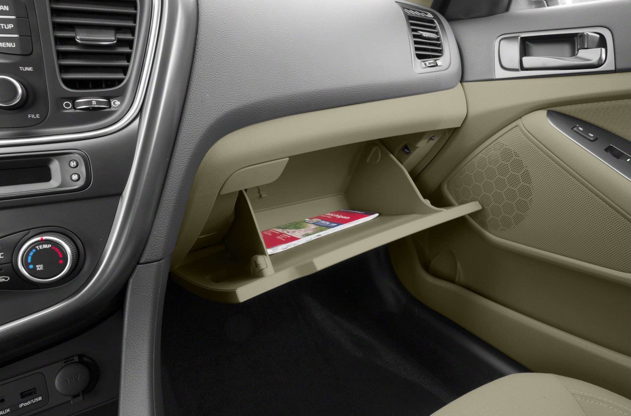 Beige interior glovebox and dashboard with controls