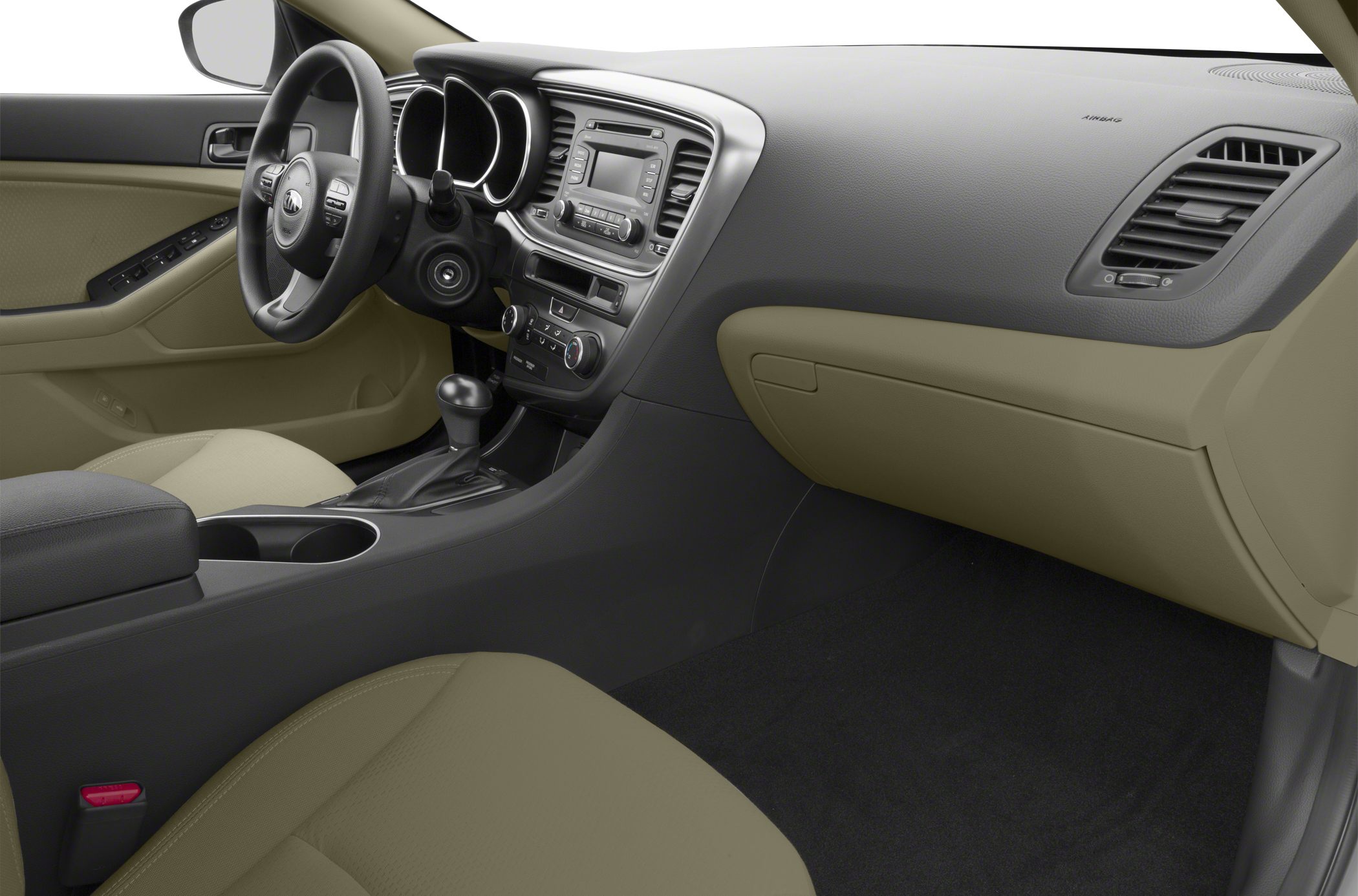 Beige and black dashboard with steering wheel and center console