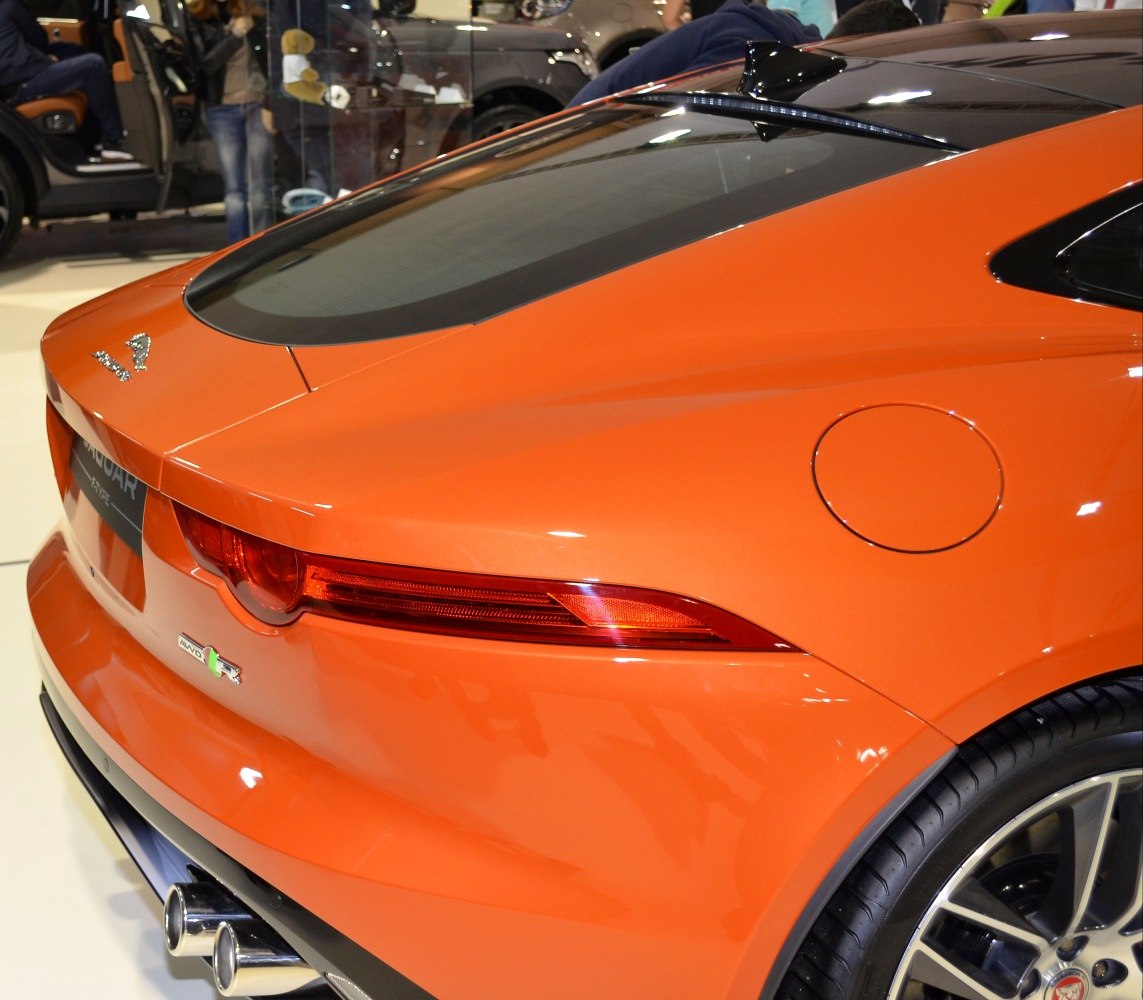Sleek rear view with tail light and dual exhaust pipes