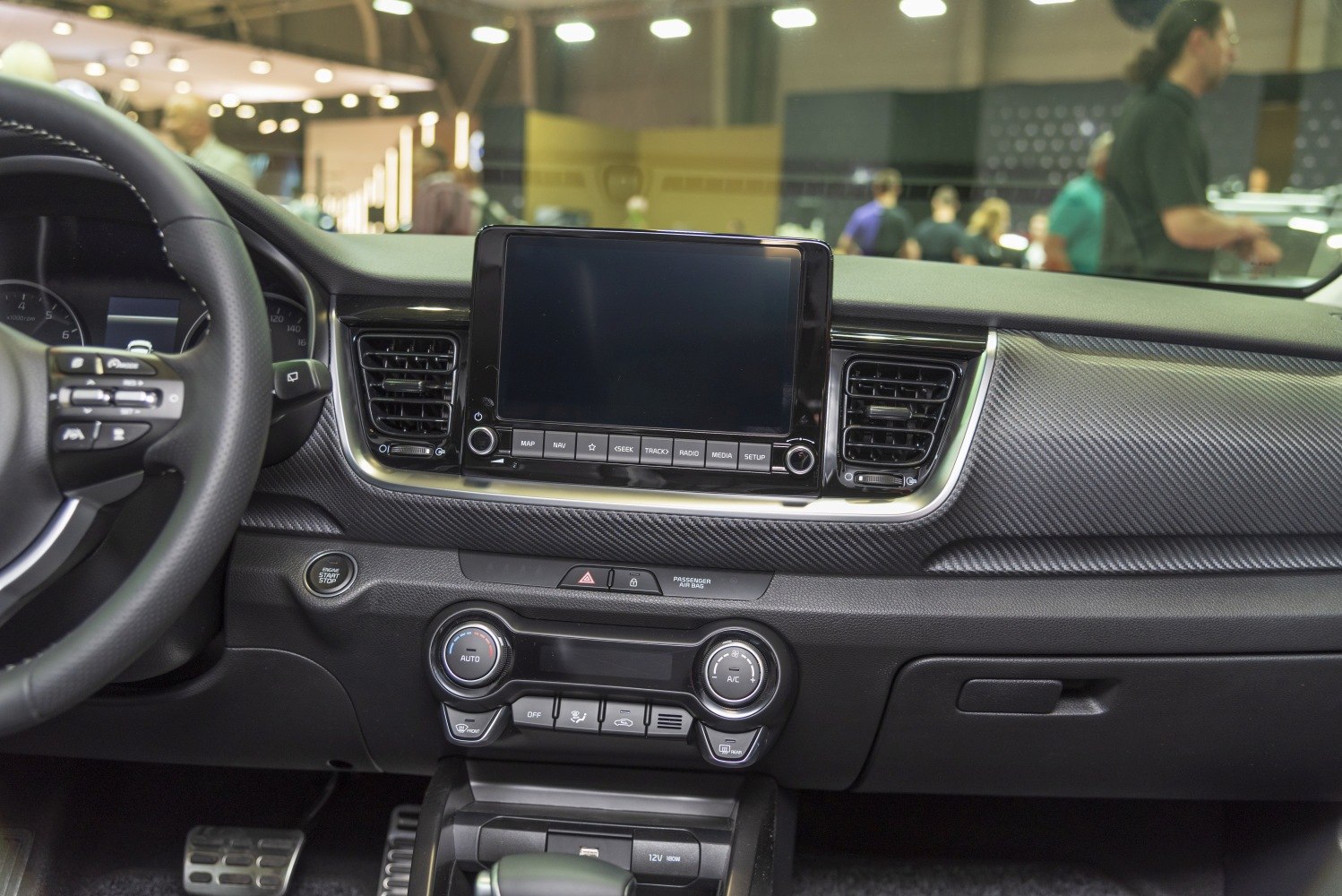 Dashboard with infotainment, climate control, and push-start button