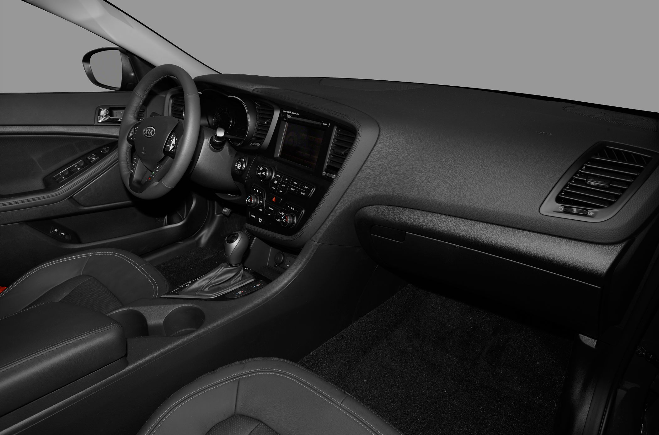 Dashboard and steering wheel interior with center console and gear shift