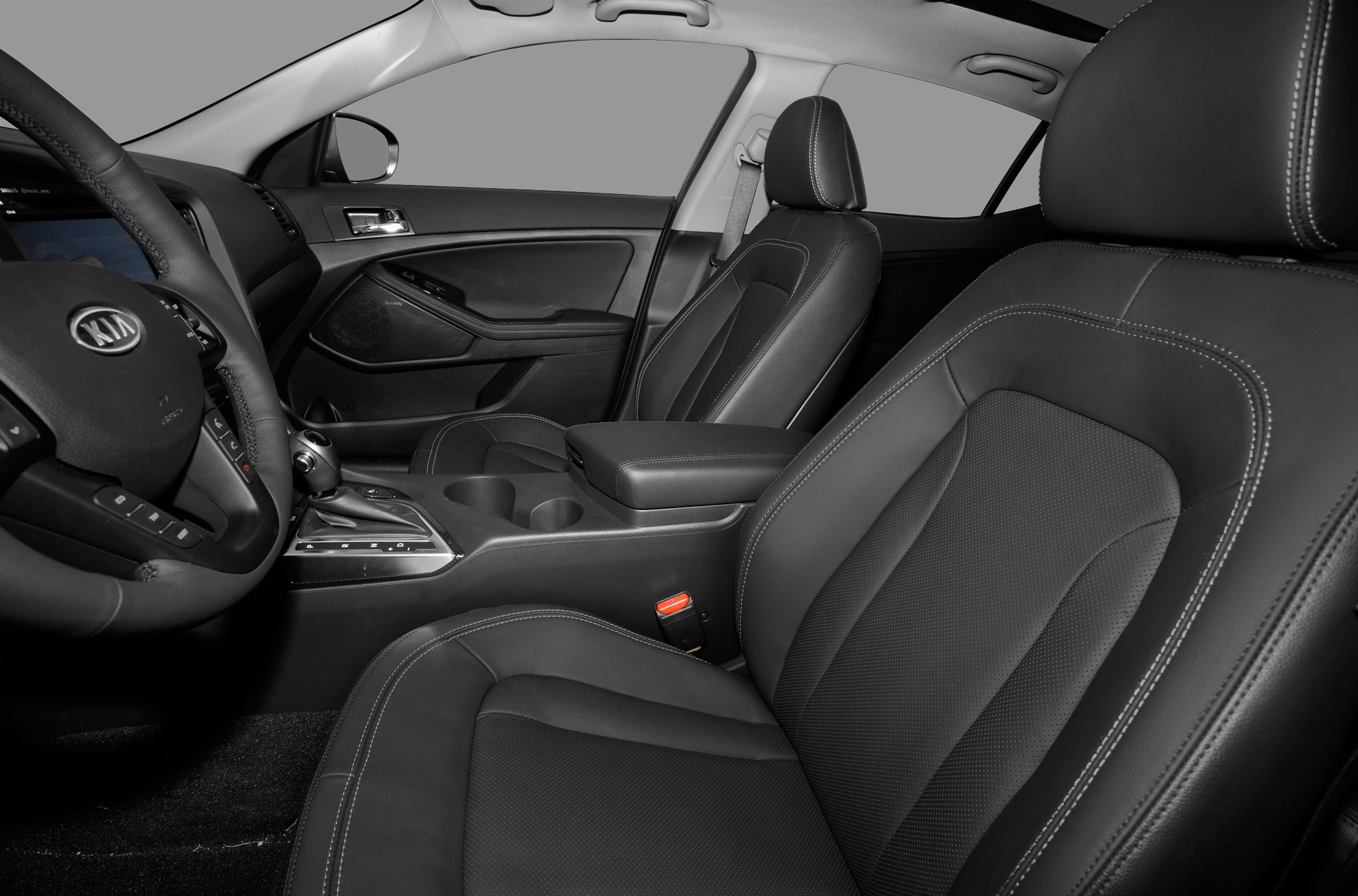 Premium black leather front seats with detailed stitching and a sleek dashboard.
