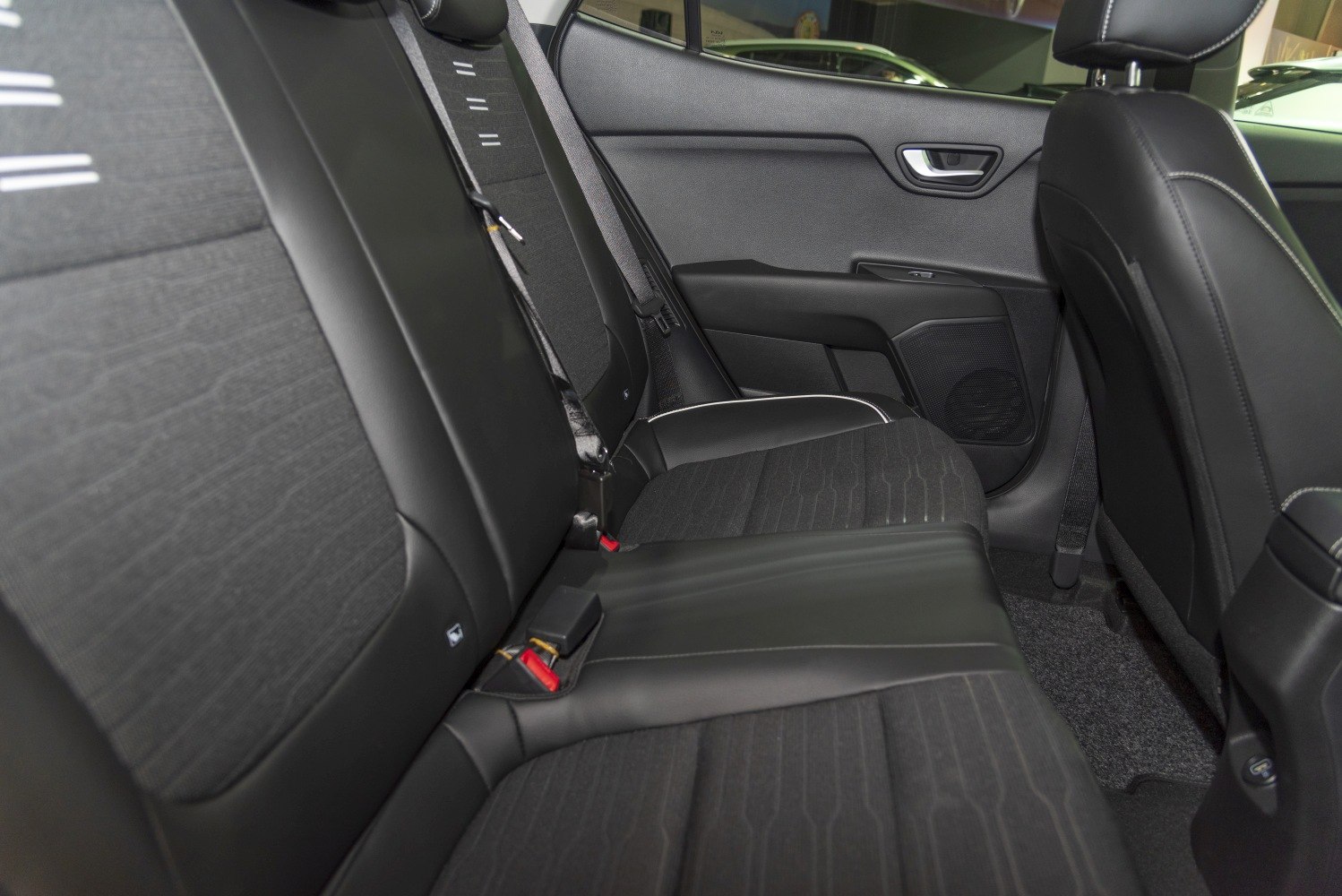 Rear seat upholstery with fabric and leather combination.