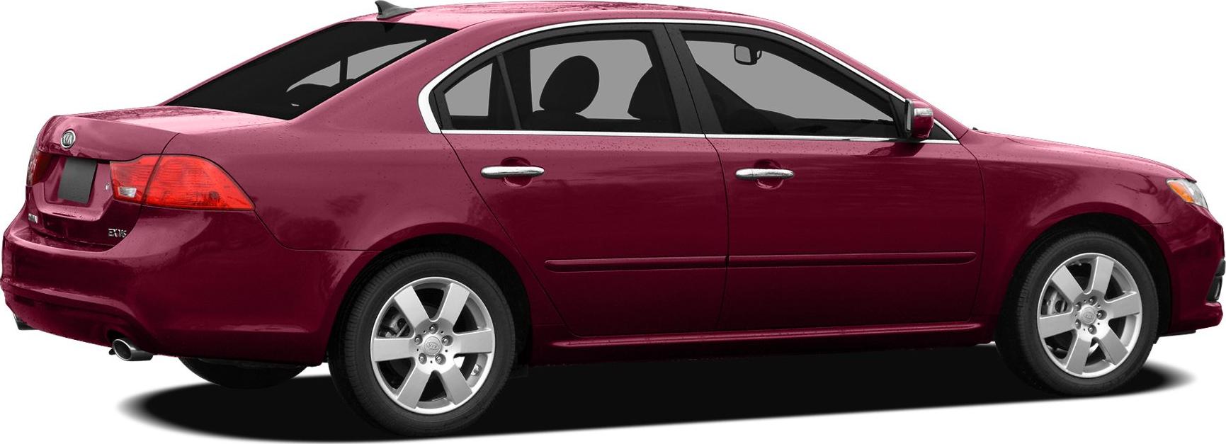 Side and rear view of red sedan with alloy wheels