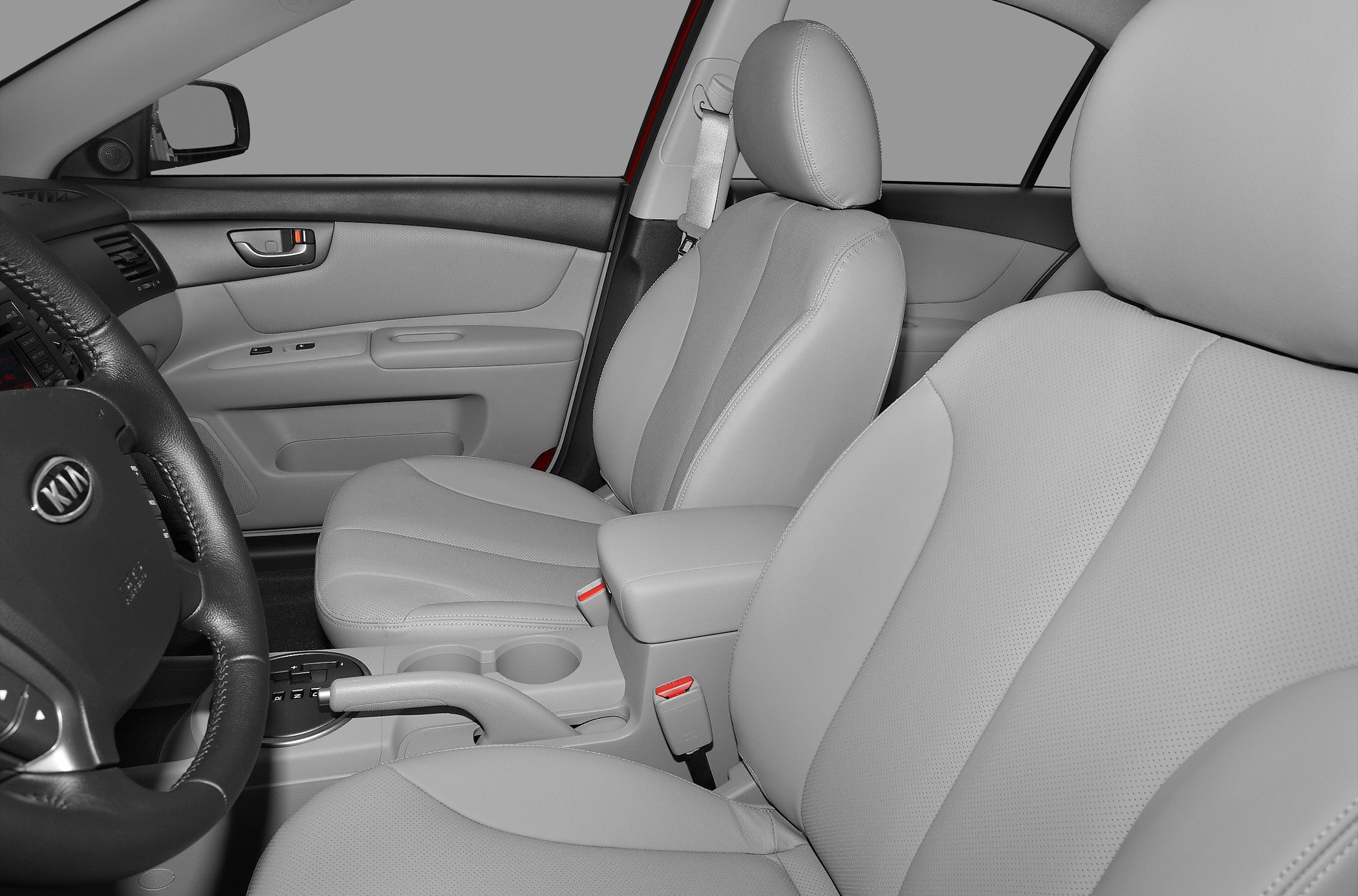 Front seats and dashboard interior with center console and steering wheel.