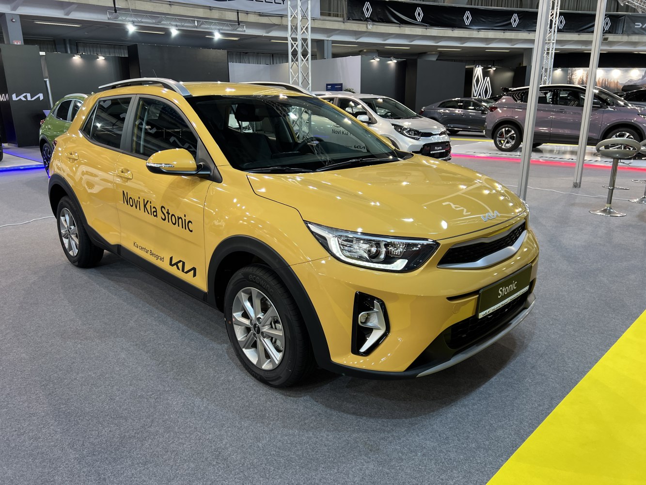 Front and side view of yellow compact SUV with modern LED headlights