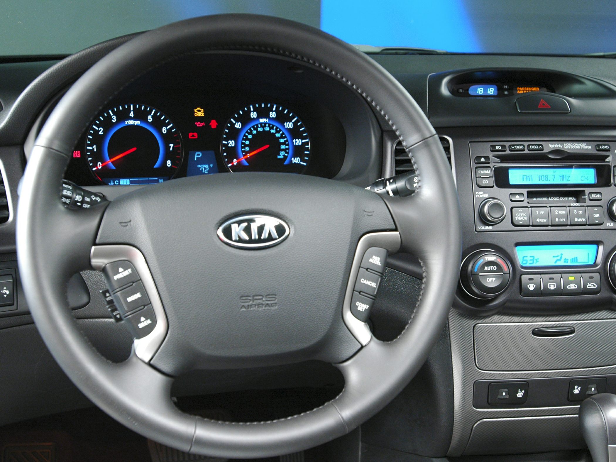 Steering wheel with controls and digital instrument cluster in car interior