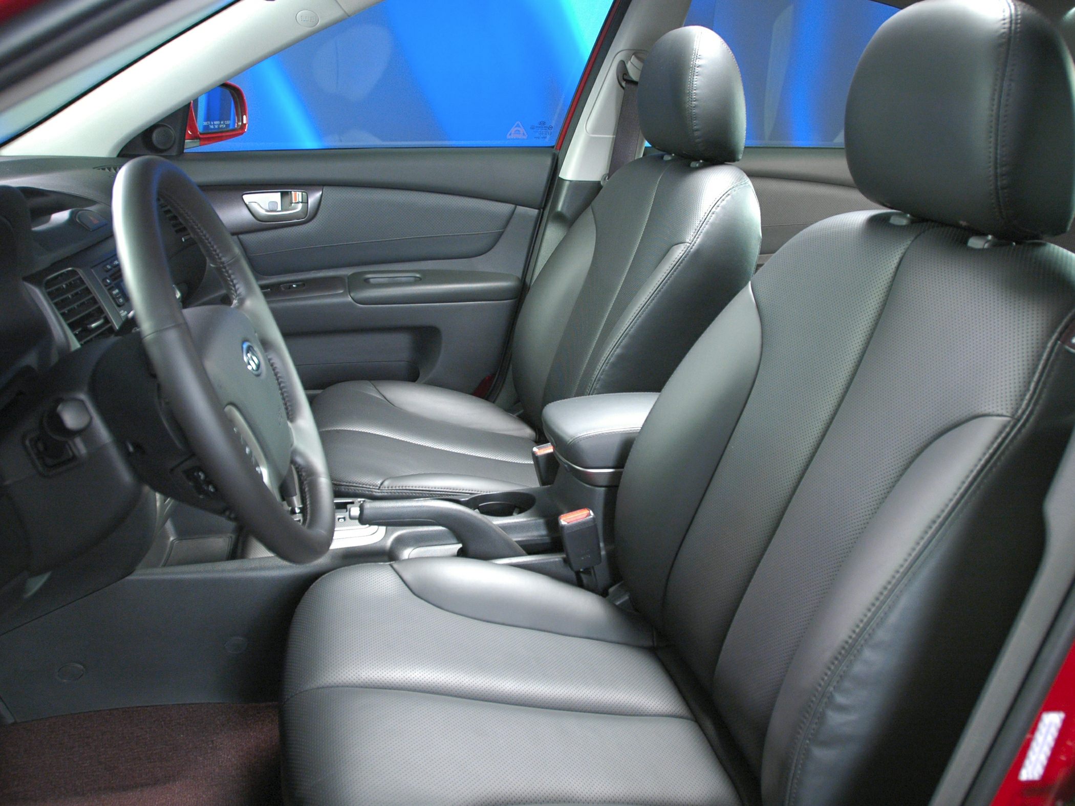 Black perforated leather seats and ergonomic steering wheel interior