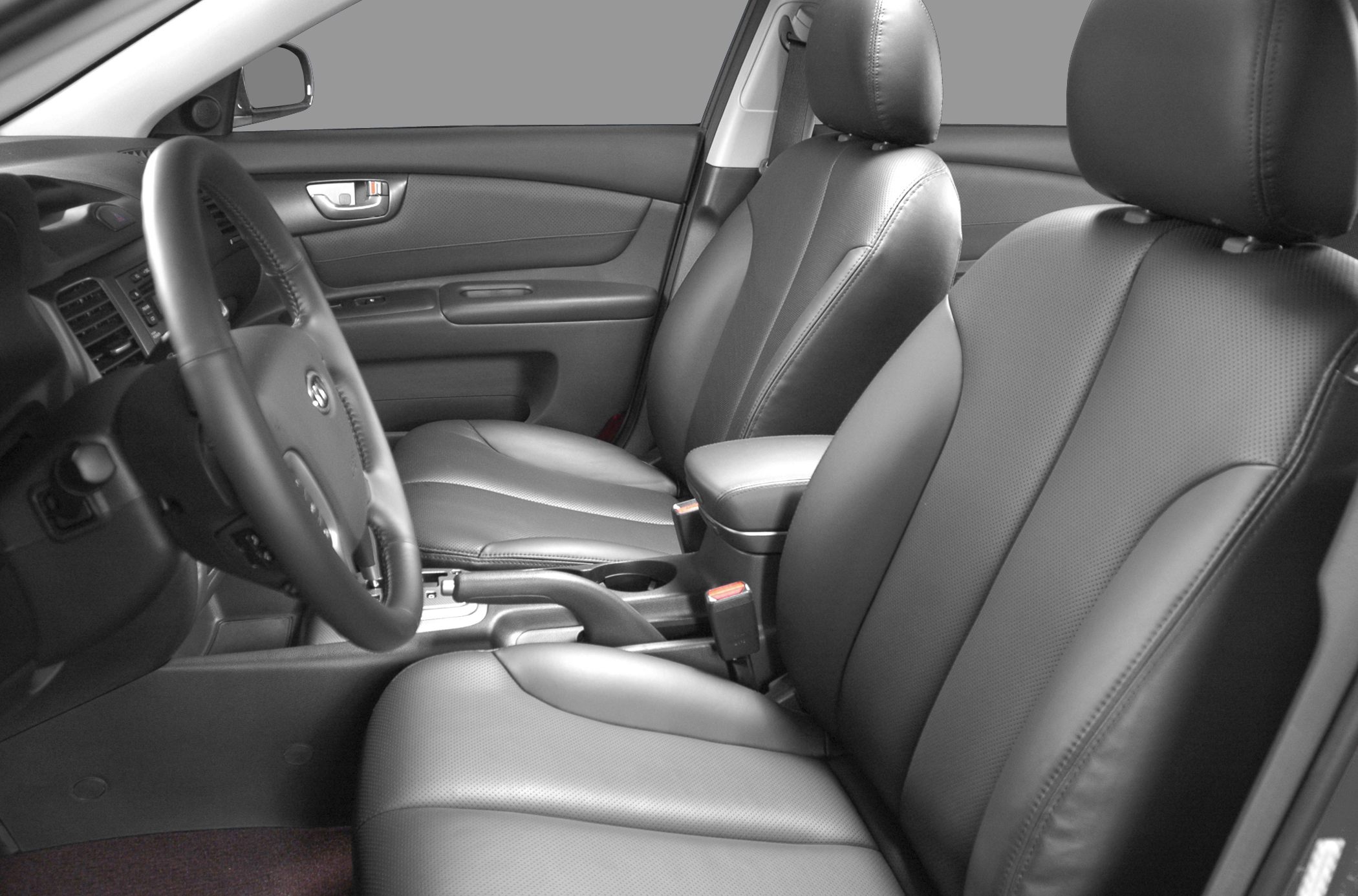 Black leather front seats and steering wheel interior