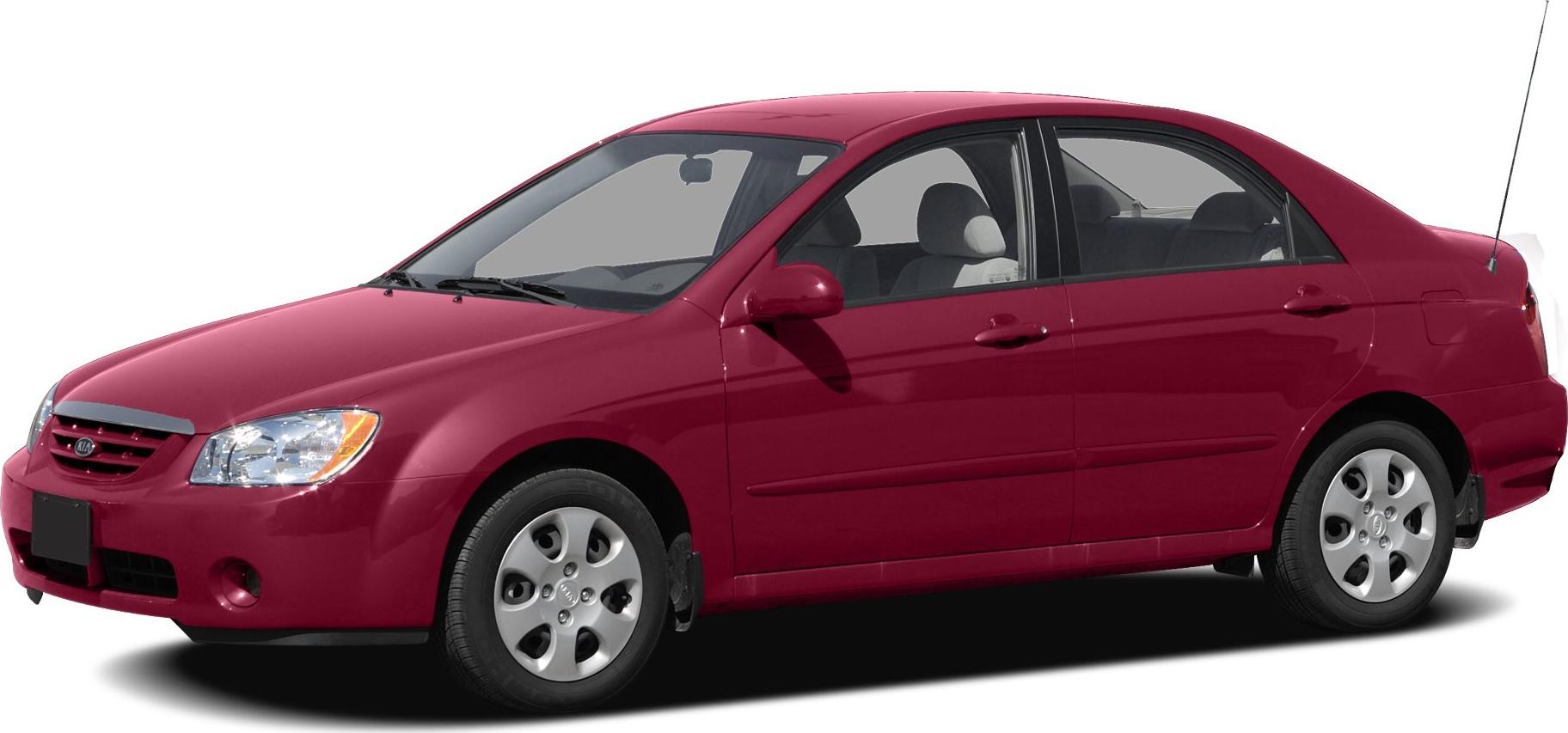 Red four-door sedan with front side view and rounded headlights