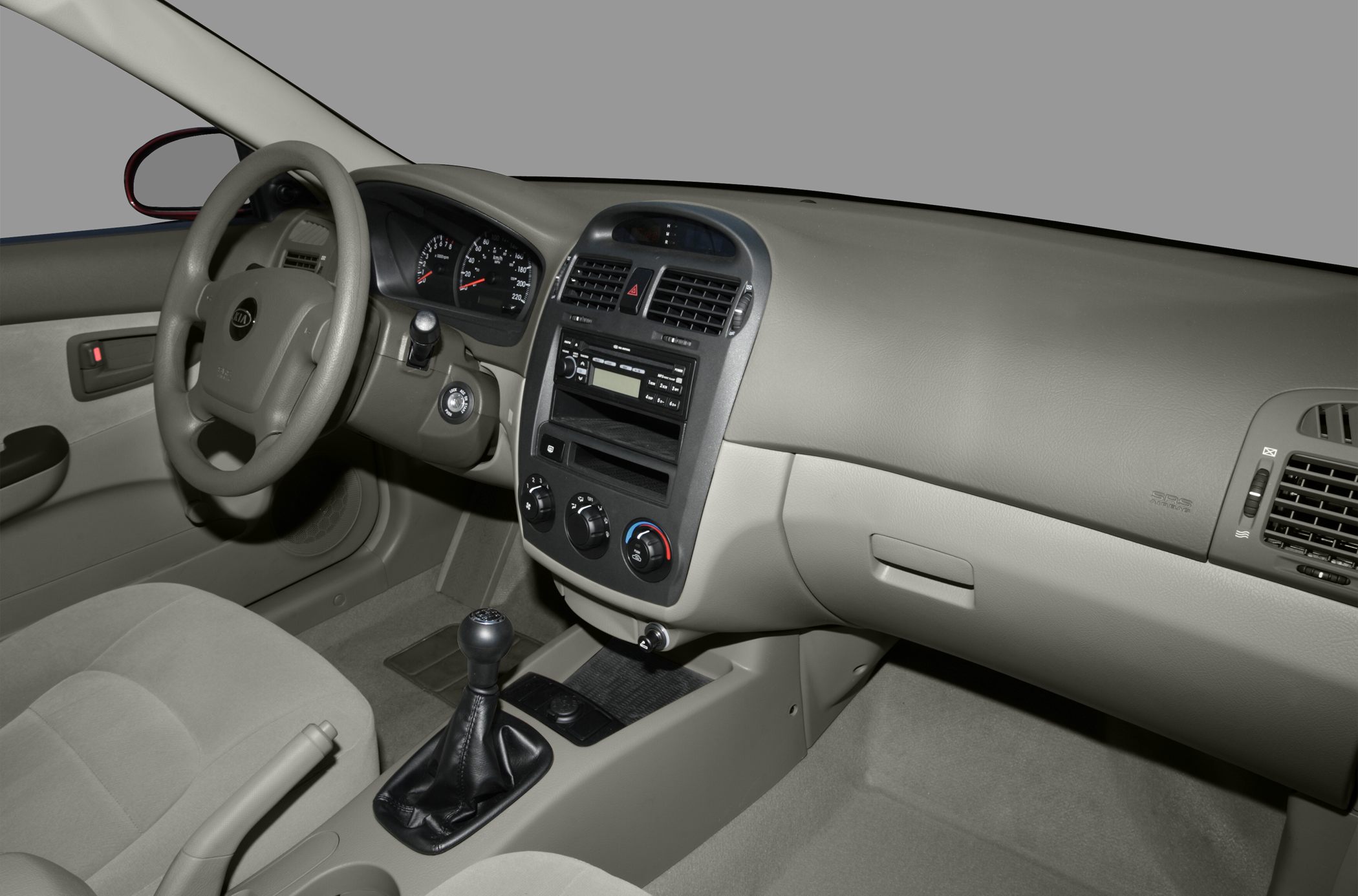 Dashboard layout with manual transmission gear shift and climate controls