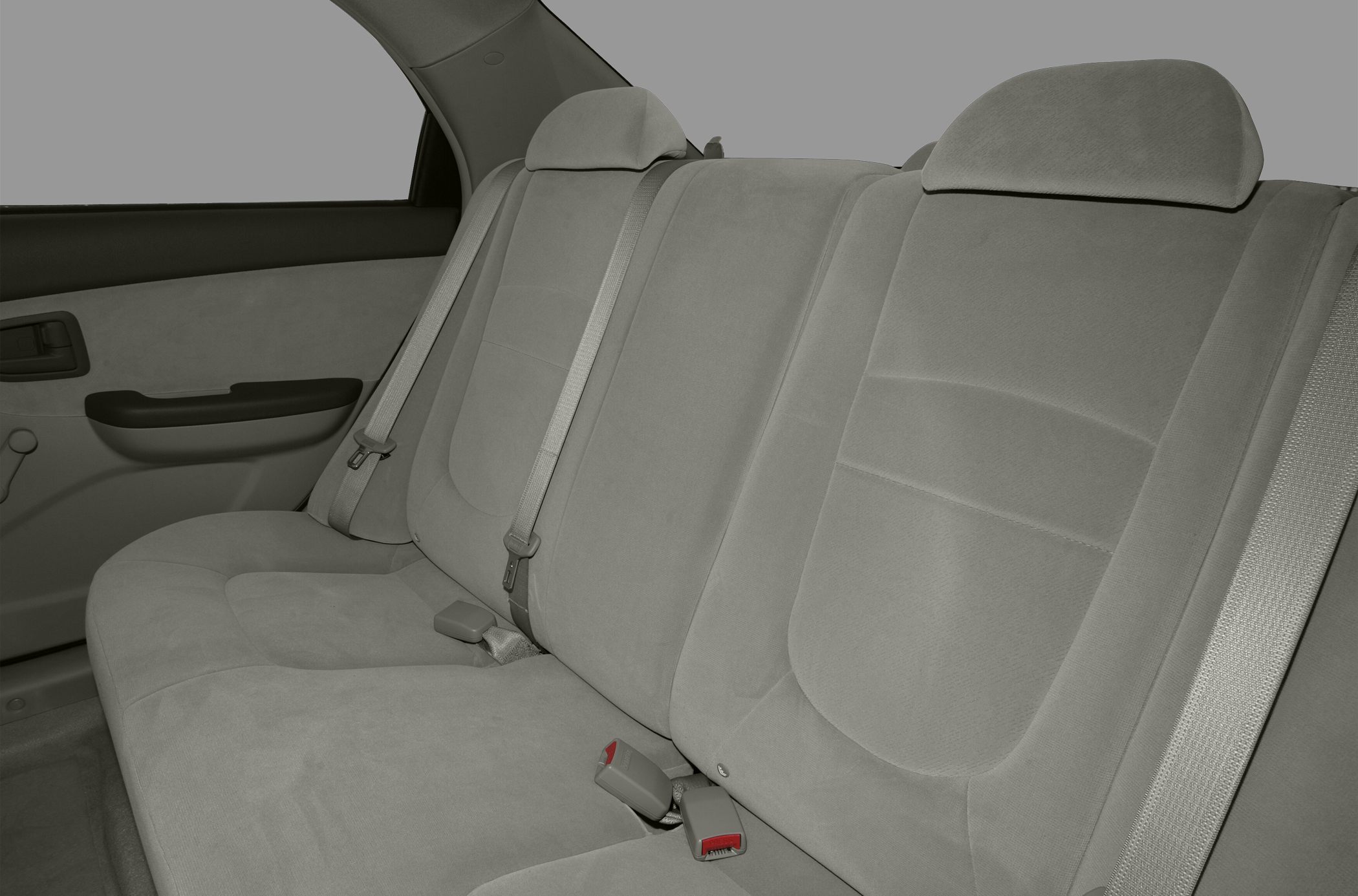 Rear seat interior with fabric upholstery and seat belts