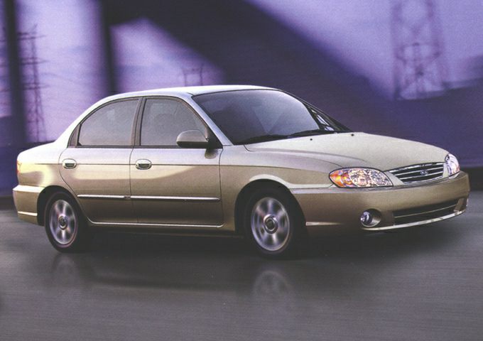 Four-door sedan with smooth body lines and characteristic grille